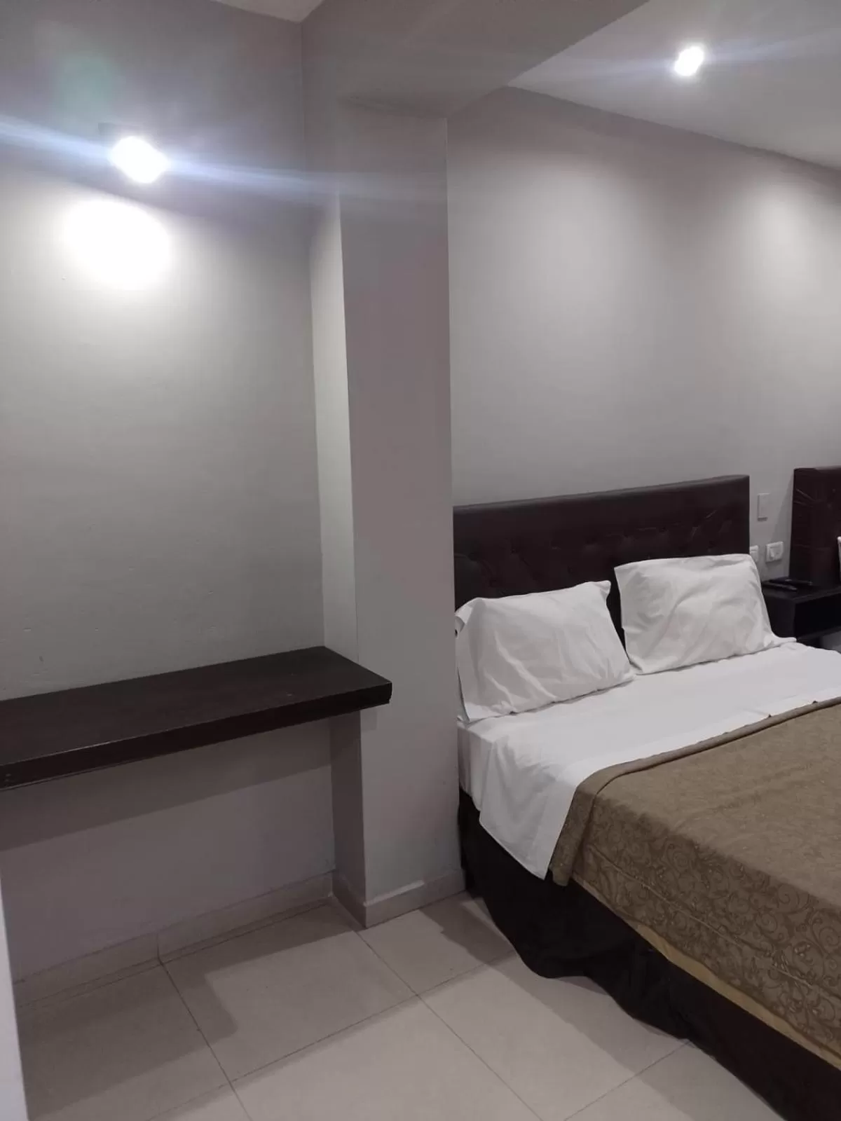 Bed in Lorenzo Suites Hotel