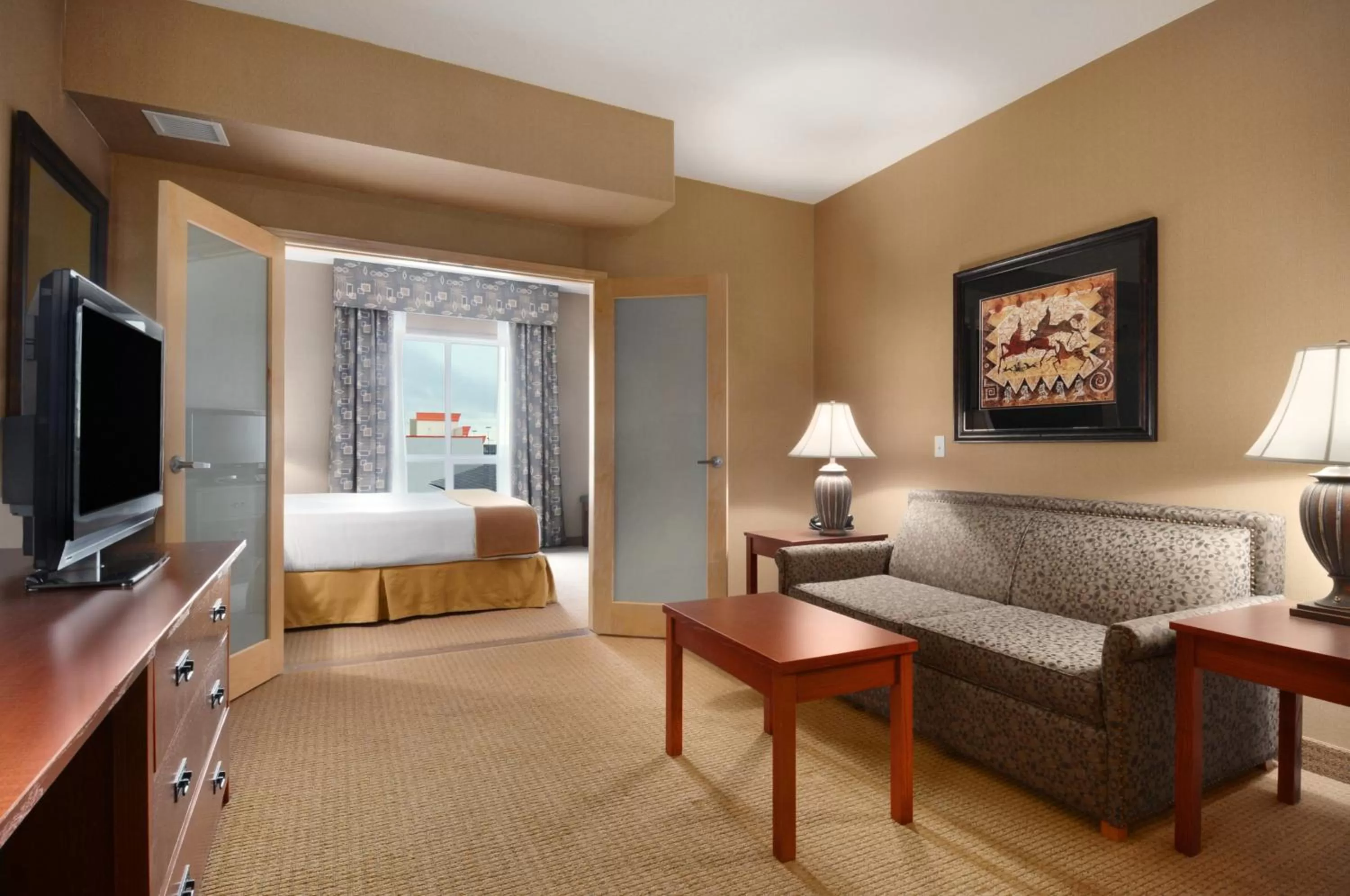 Living room, Bed in Days Inn & Suites by Wyndham Strathmore