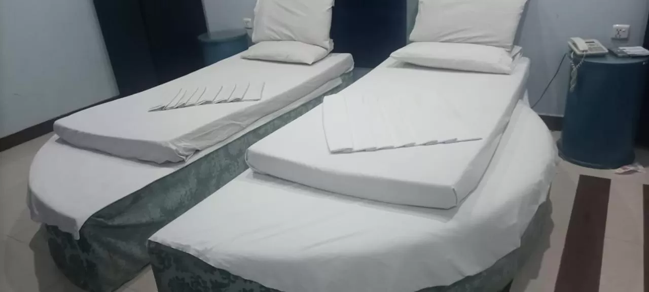 Bed in Hotel Grace inn