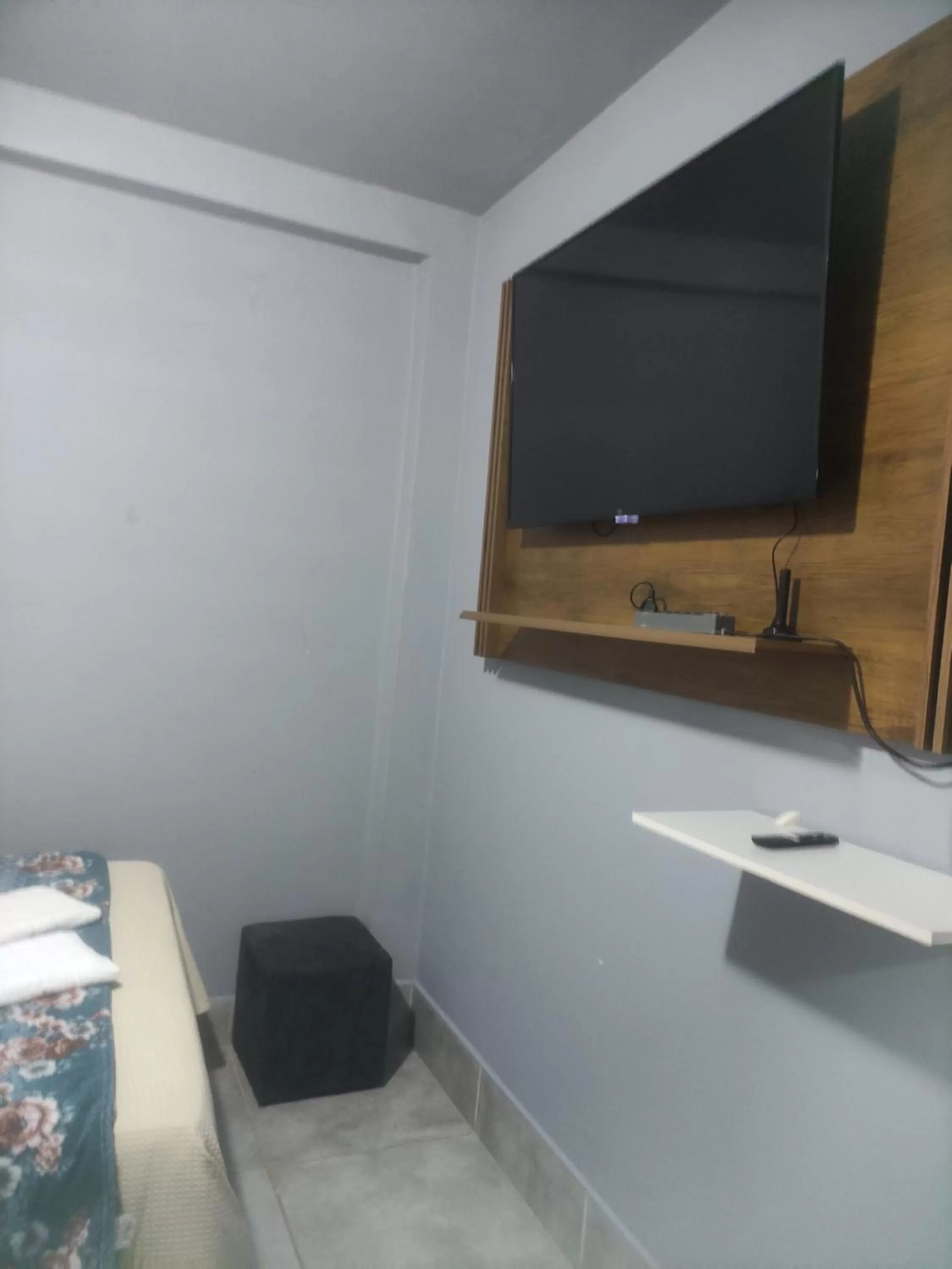 TV/Entertainment Center in Pousada da Gi Suítes e Turismo