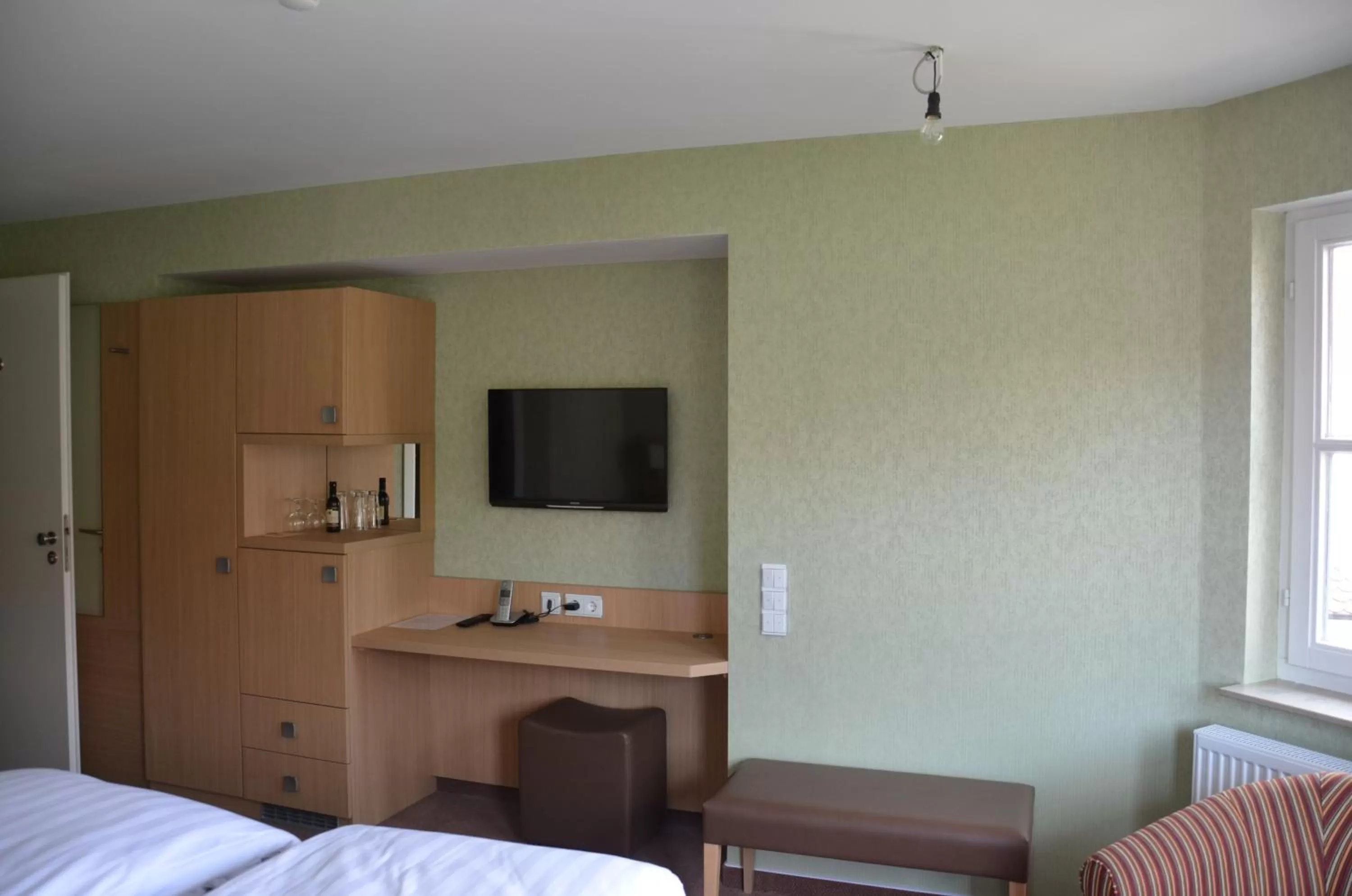 TV and multimedia, TV/Entertainment Center in Hotel Ortel