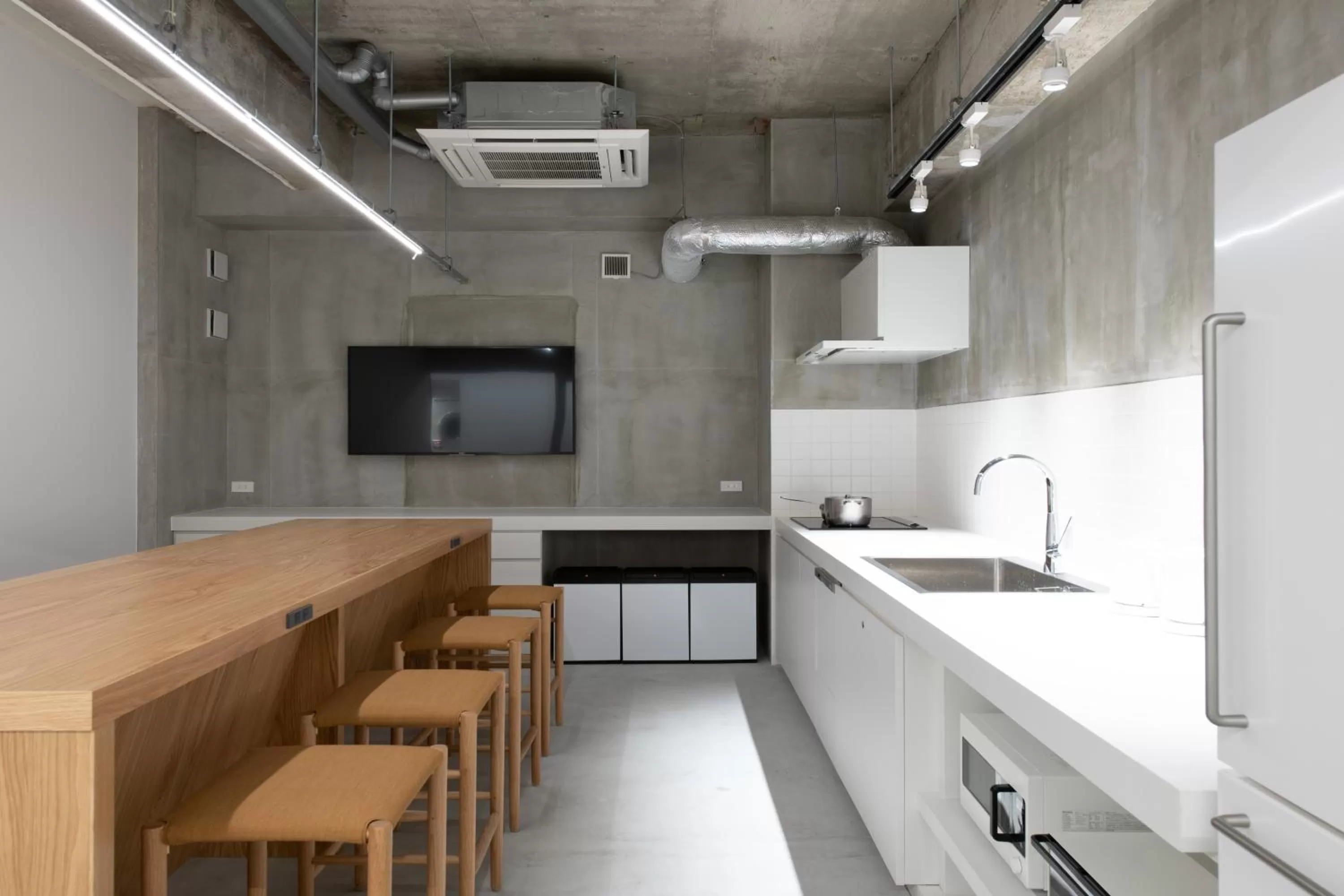 Communal kitchen in KIRO Hiroshima by THE SHARE HOTELS