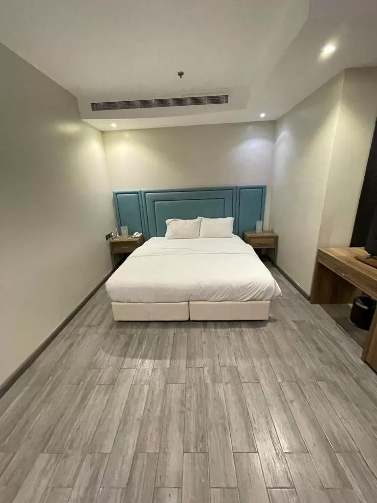 Bed in Stay Inn Suites