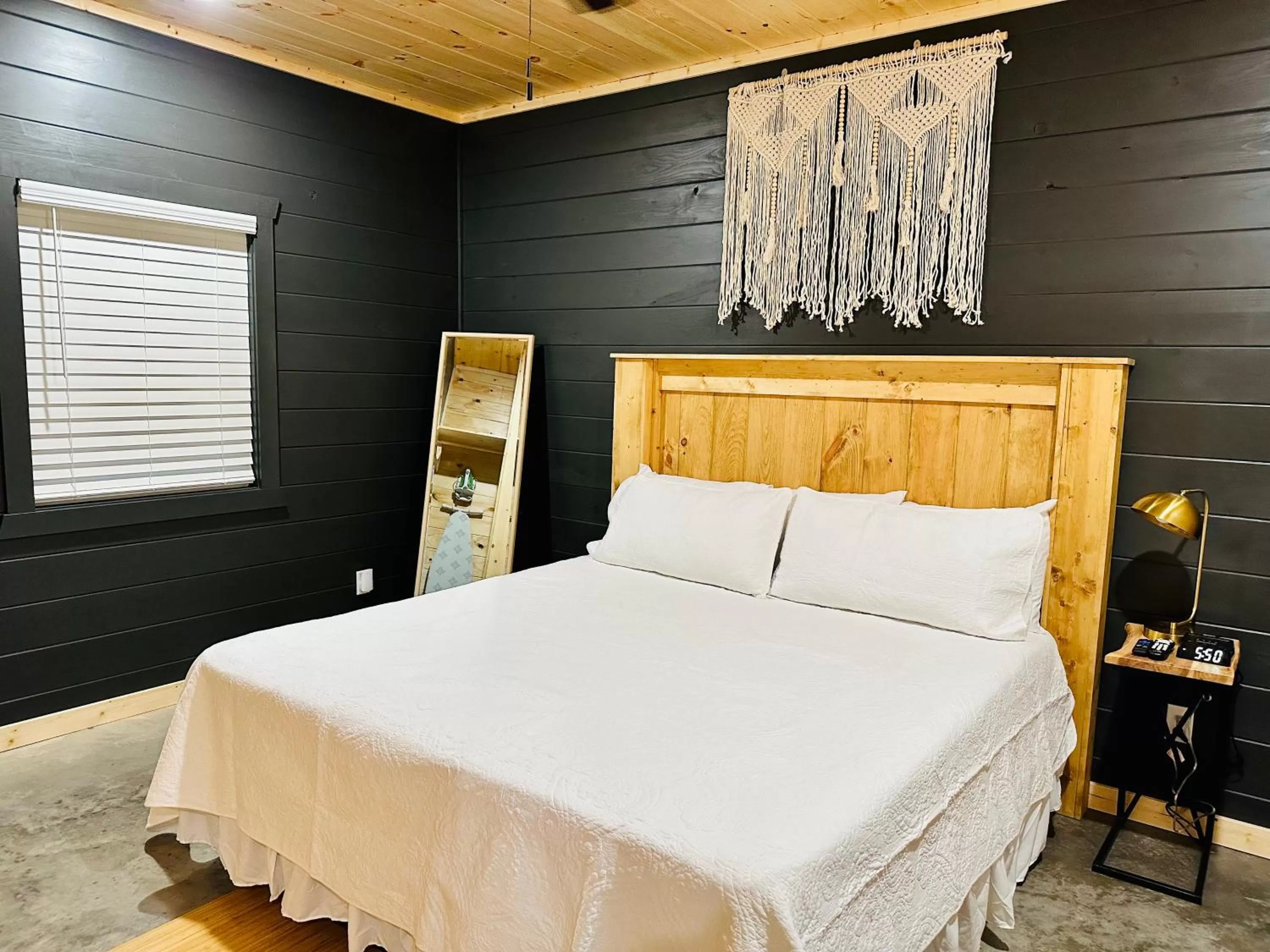 Bed in Knotty Squirrel Cabins