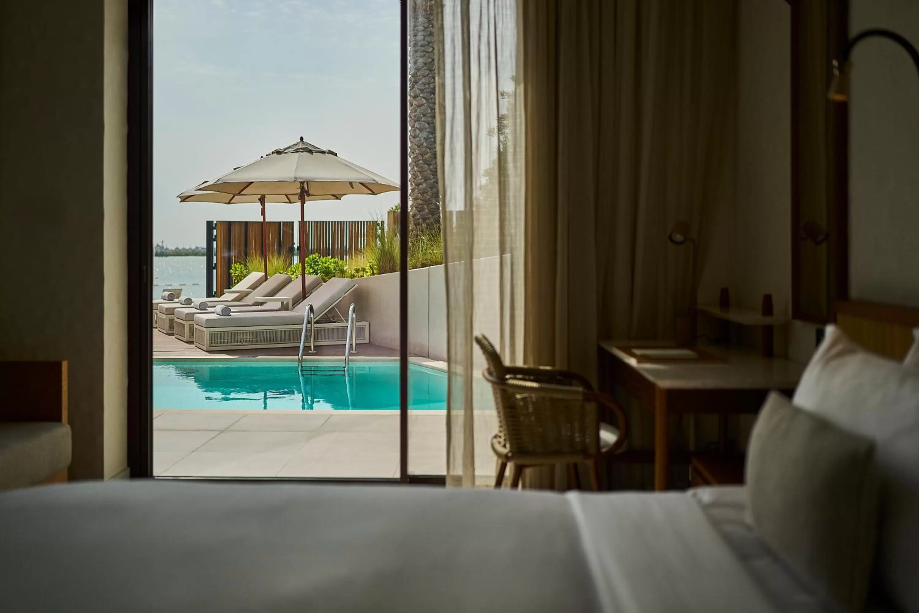 Pool view, Bed in ERTH Abu Dhabi Hotel
