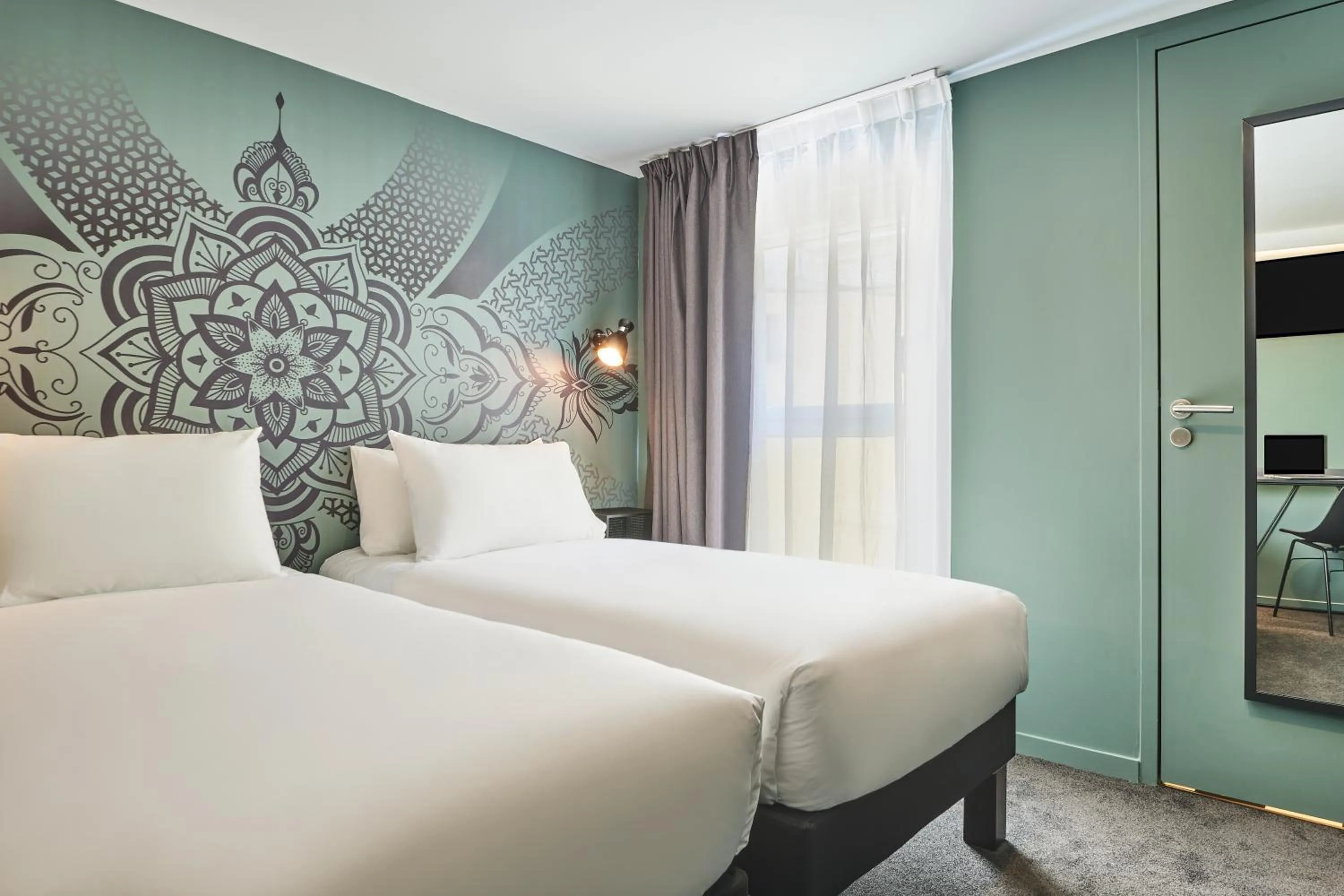 Photo of the whole room, Bed in Ibis Styles Paris Gare de l'Est Magenta