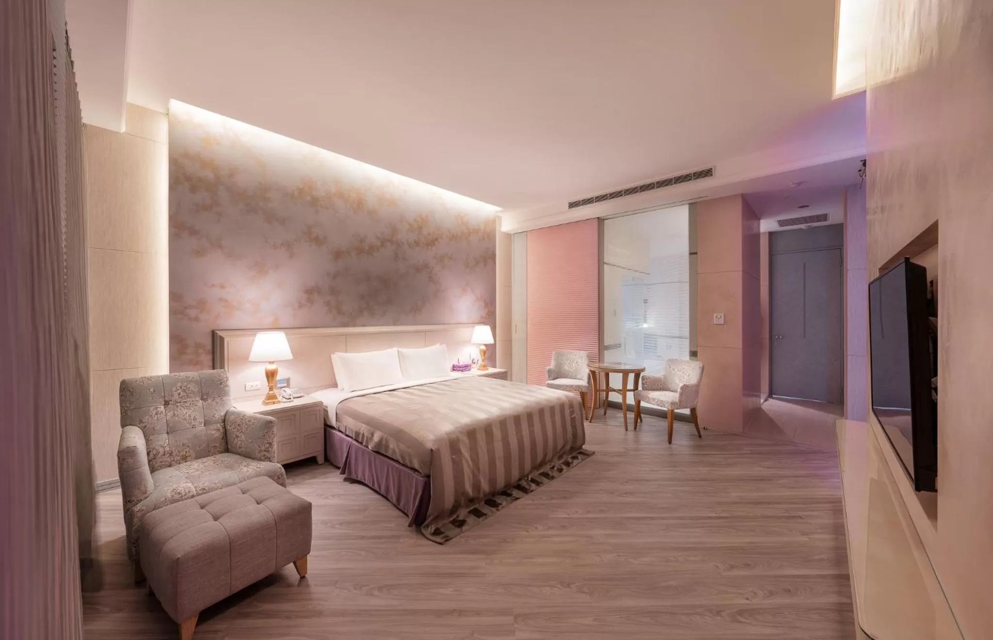 Bed in Purple Garden Motel