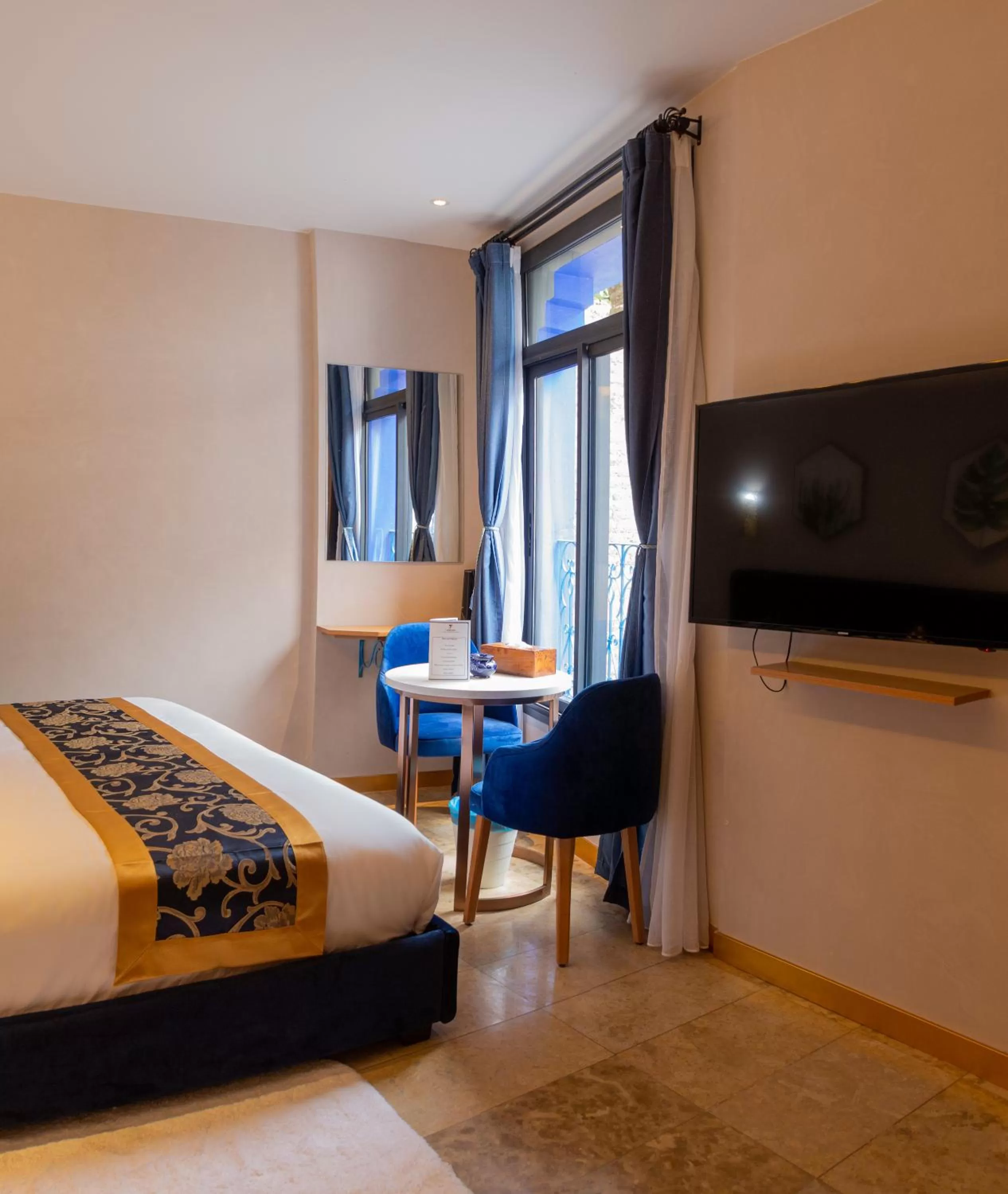 Communal lounge/ TV room, Bed in VANCII Hotel