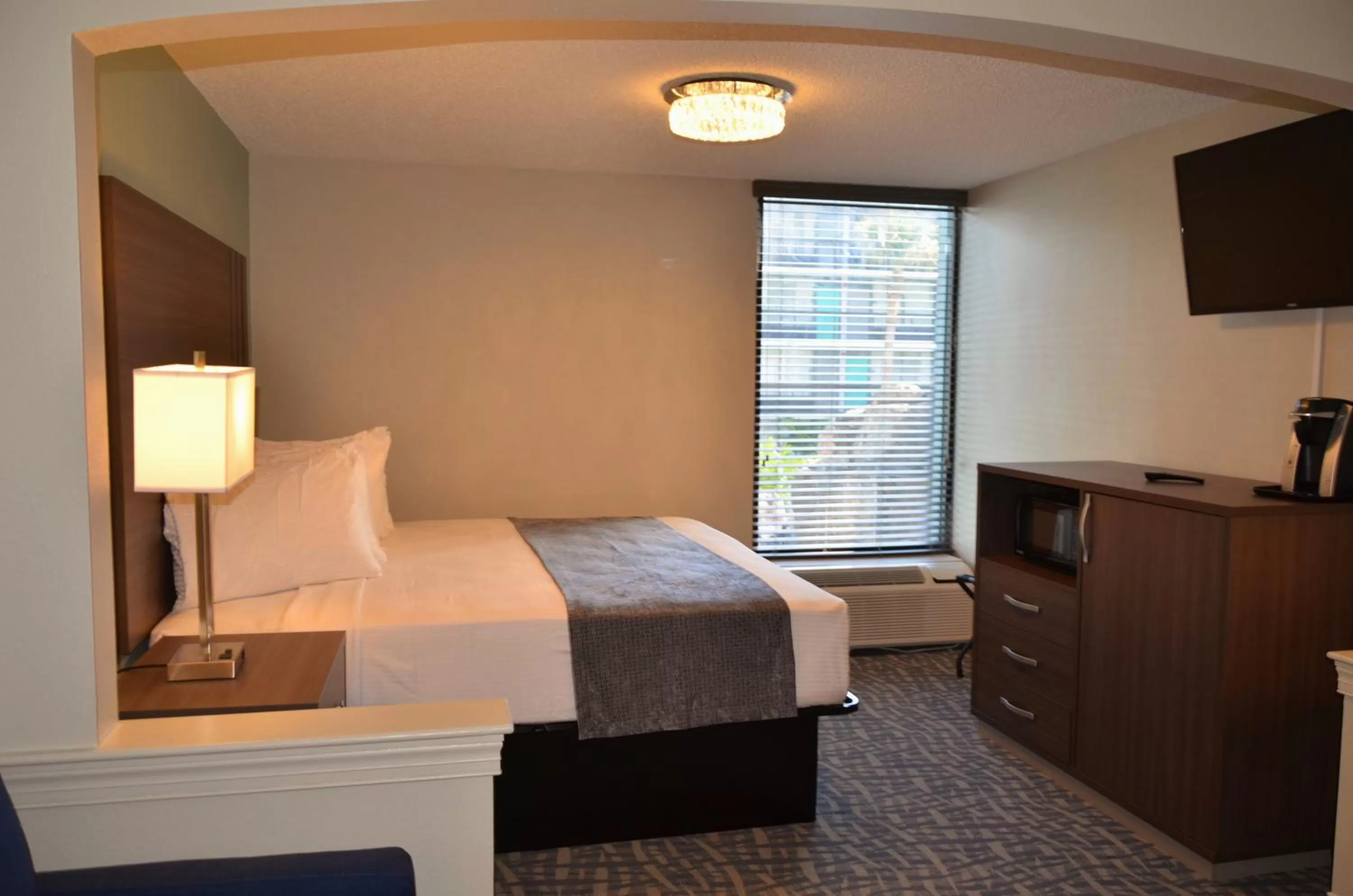 Bed in Opal Hotel & Suites