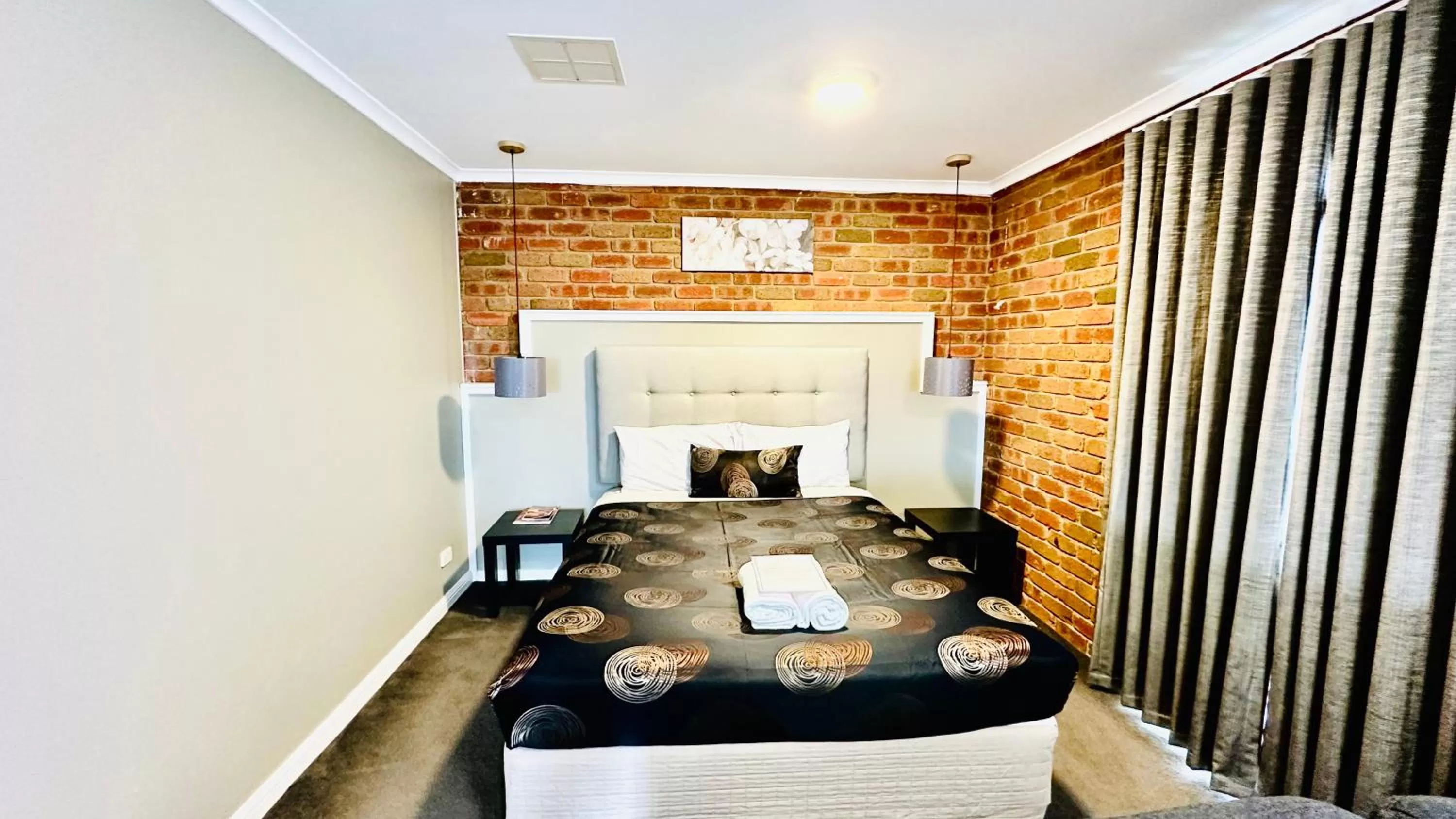 Bed in Early Australian Motor Inn