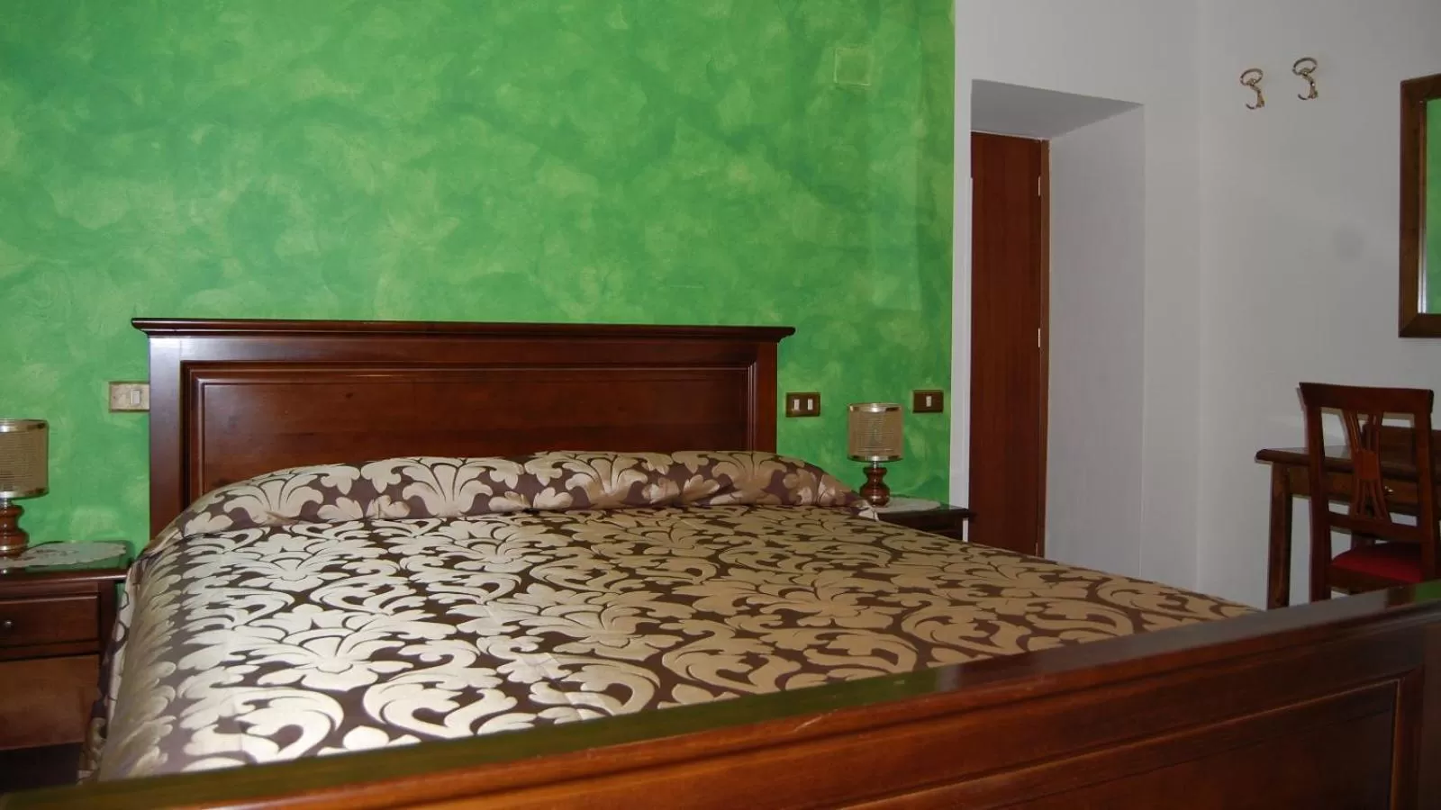 Bed in Albergo Miramonti