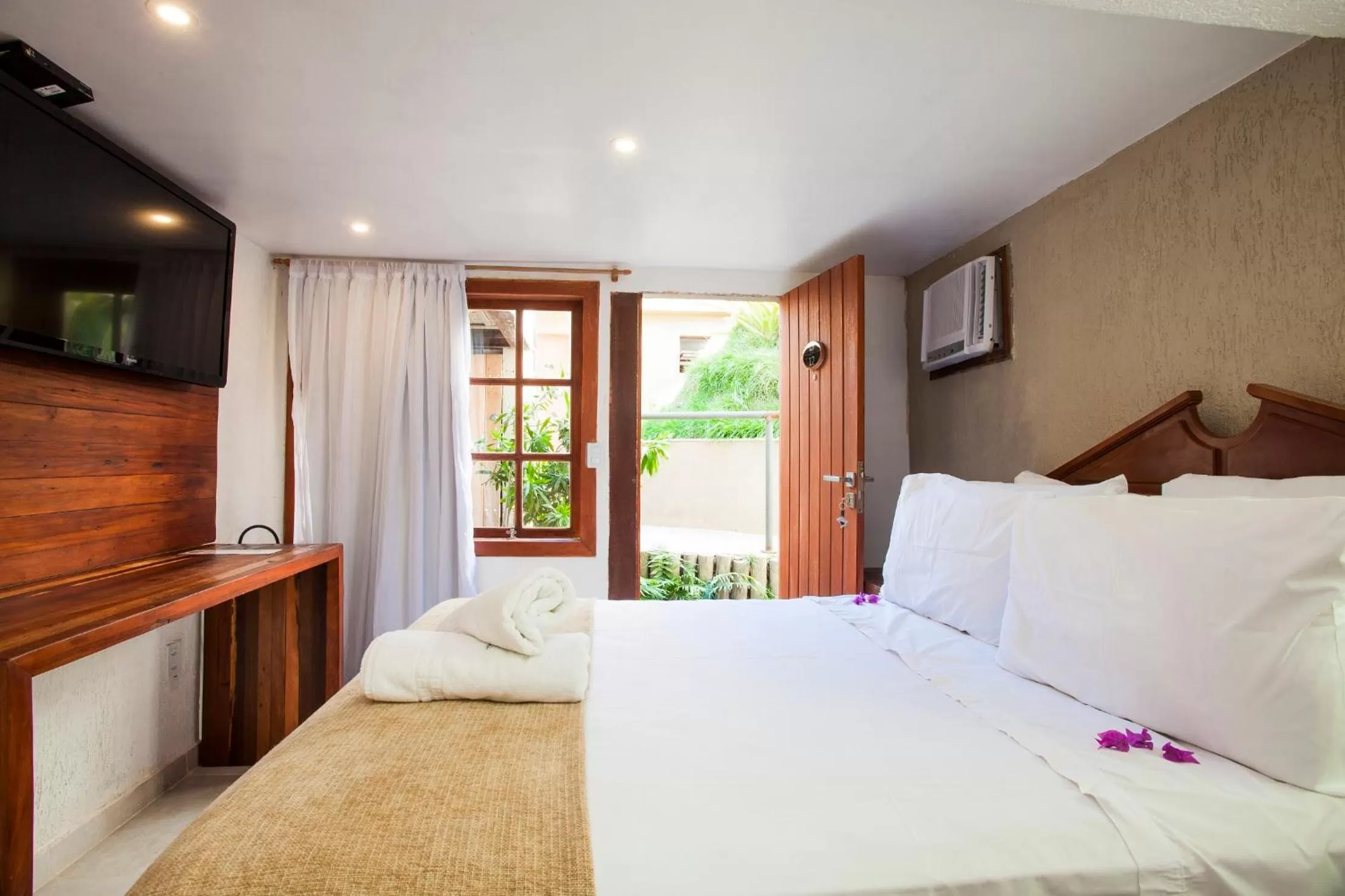 Bed in Pousada Praia João Fernandes