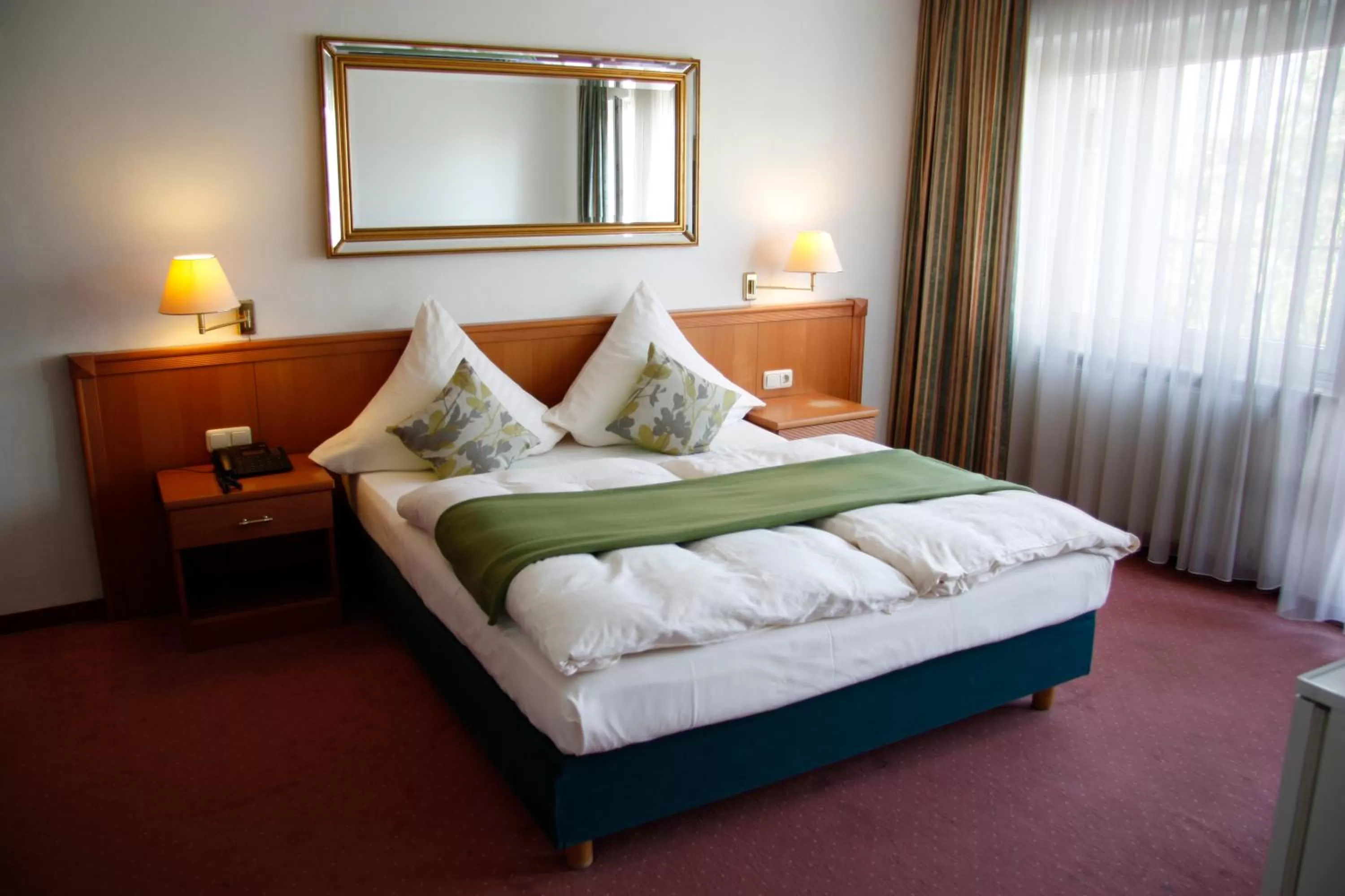 Bed in INA Hotel Royal