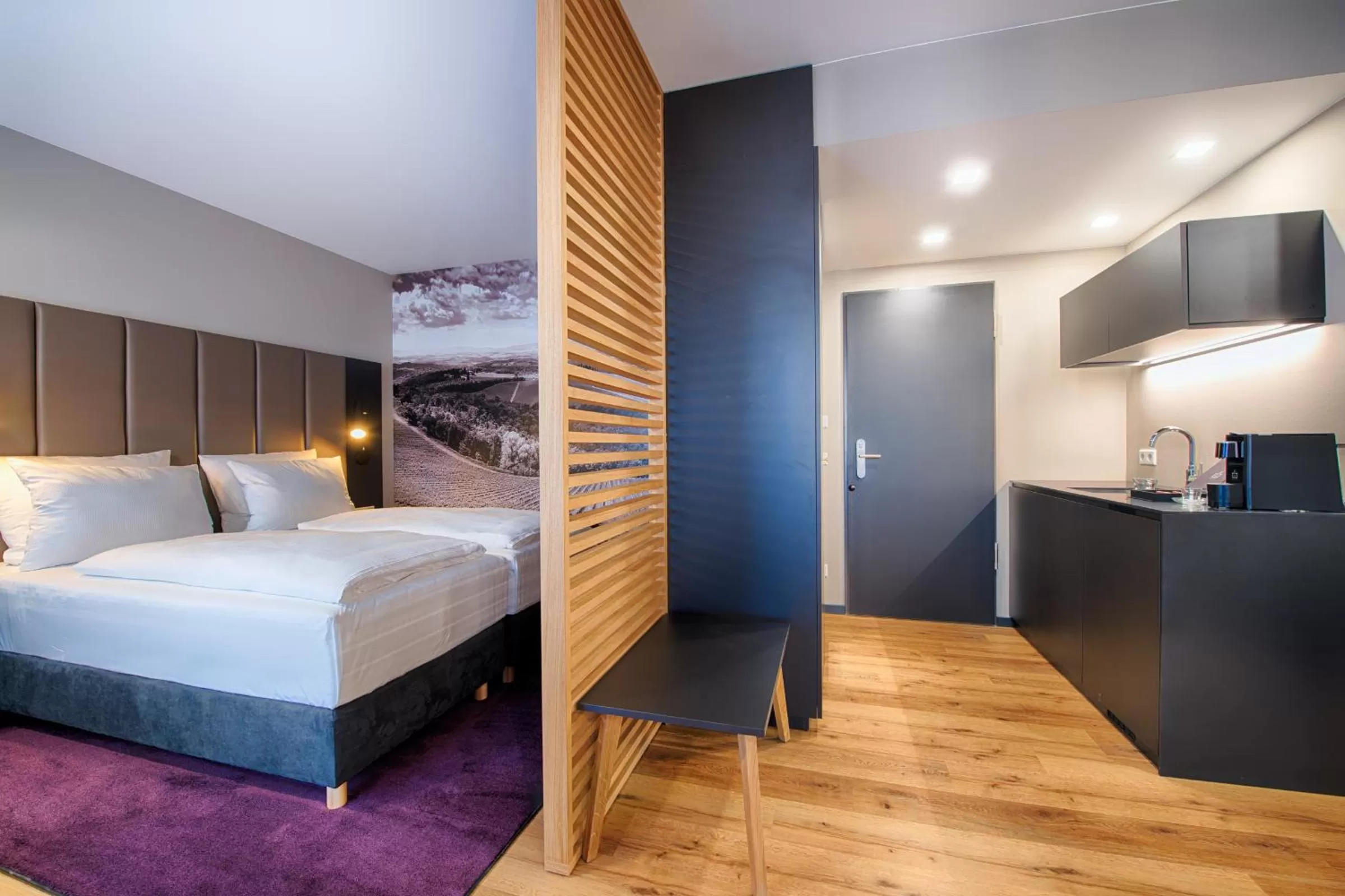 Kitchen or kitchenette, Bed in Welcome Hotel Neckarsulm