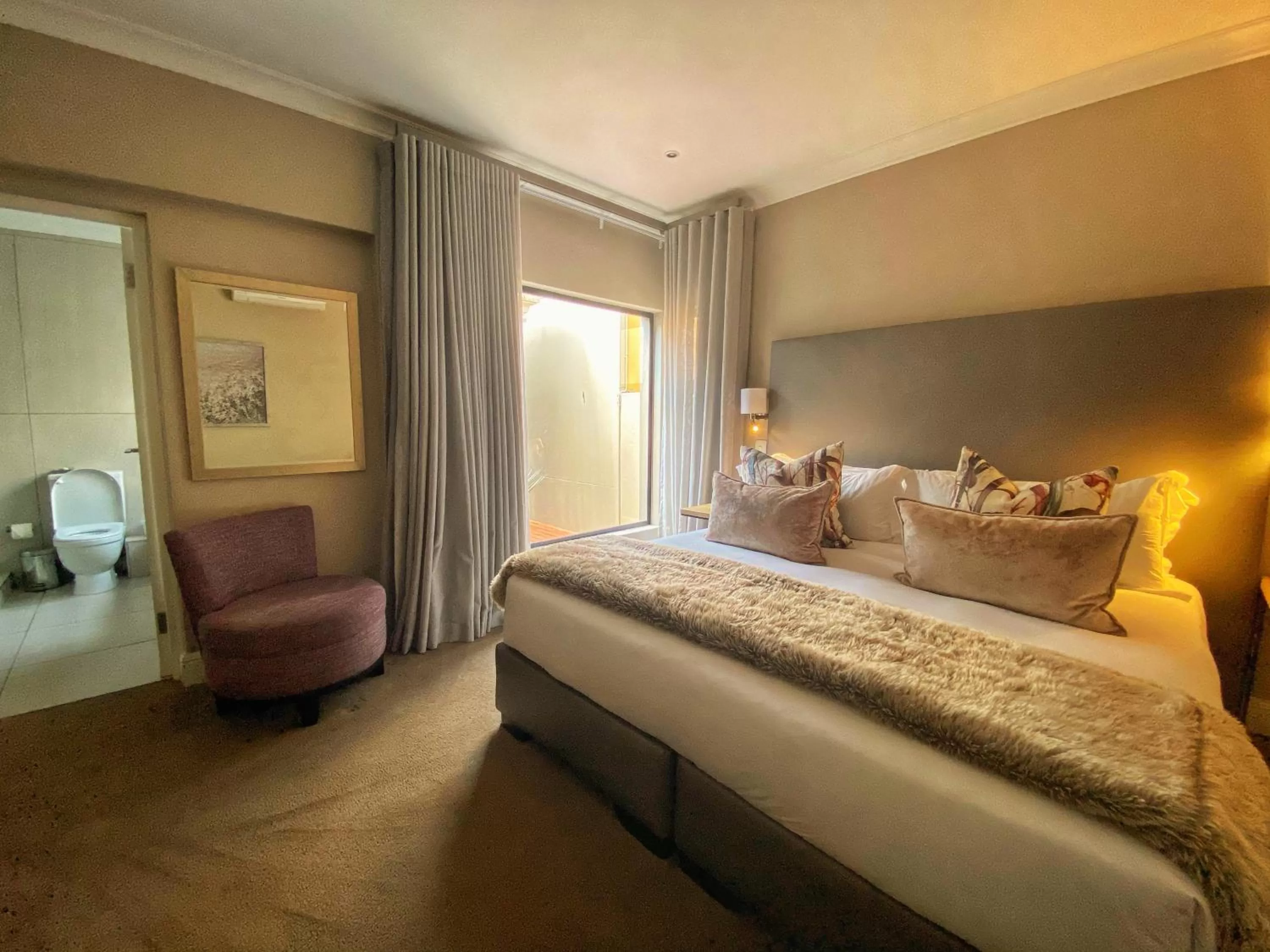 Bed in The Northcliff Boutique Hotel