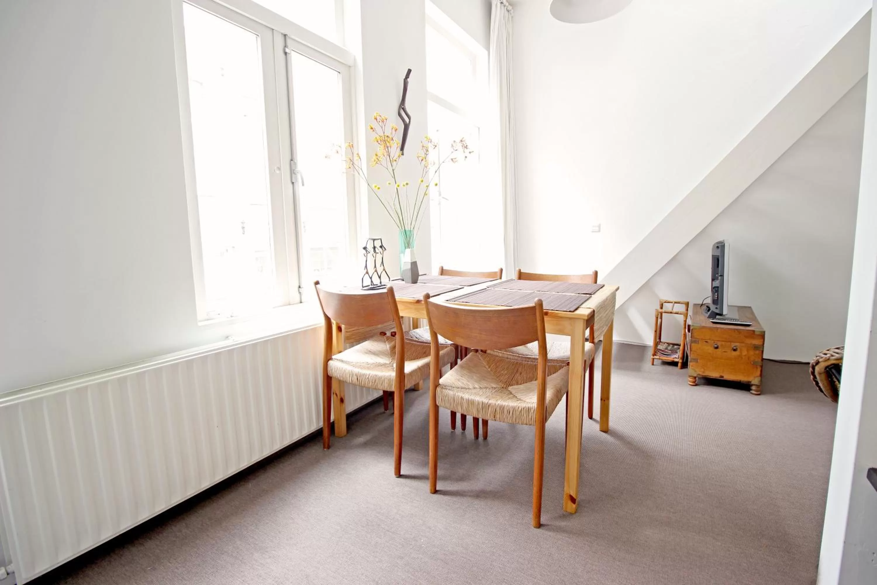 Dining area in Beautiful 2 floor Vondelpark apartment.