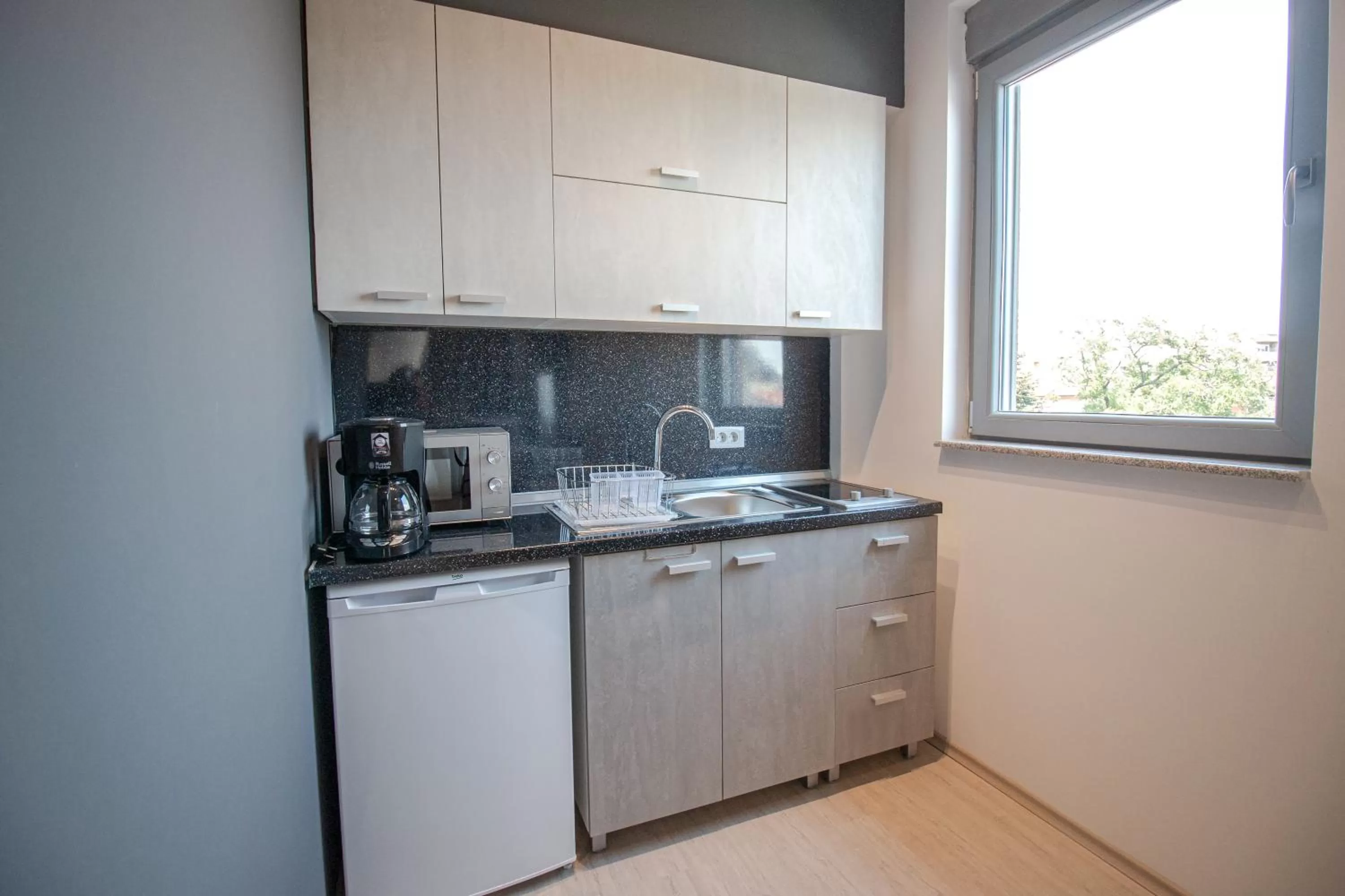 Kitchen or kitchenette in OASIS Apartments