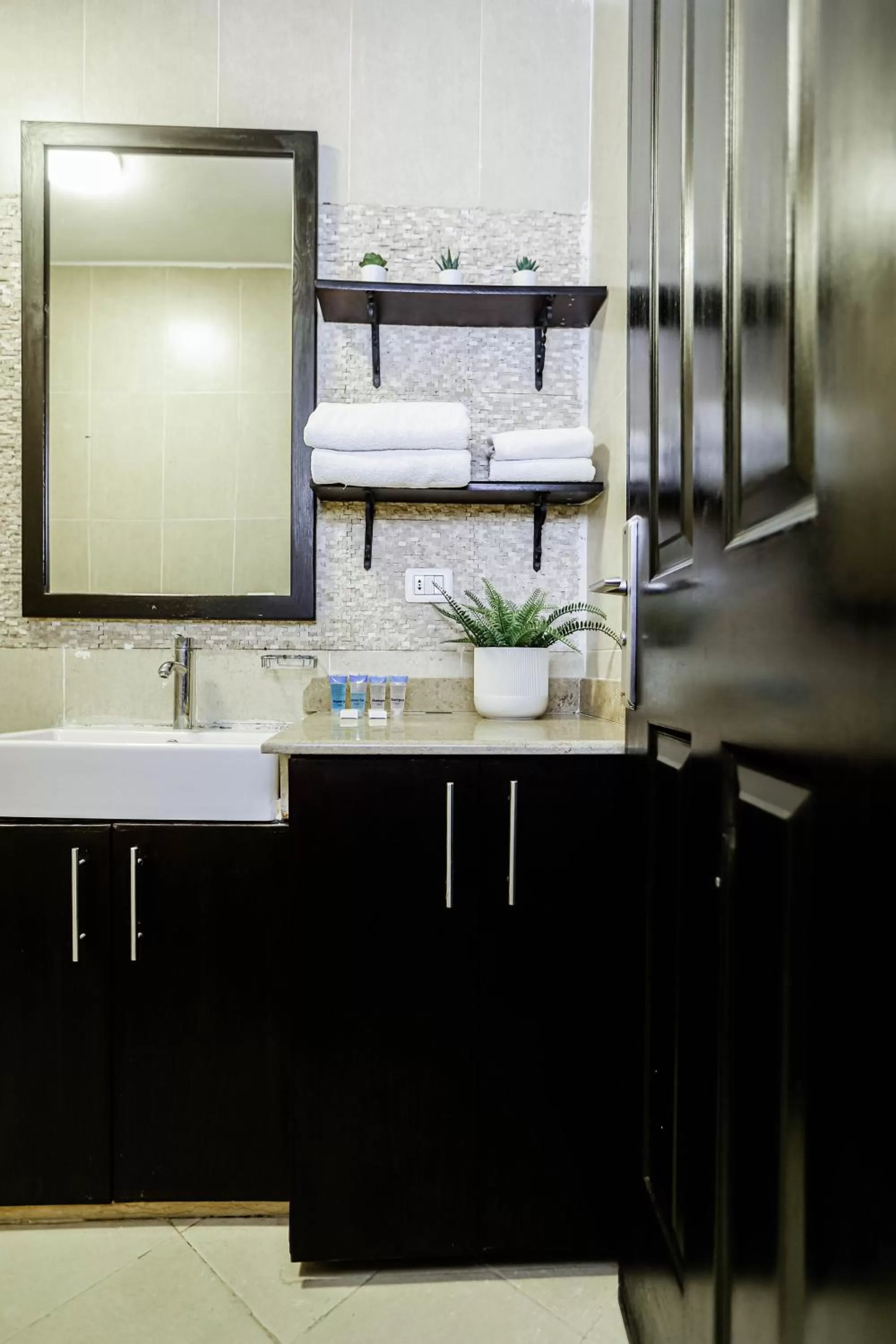 Bathroom in NewCity Hotel & Suites