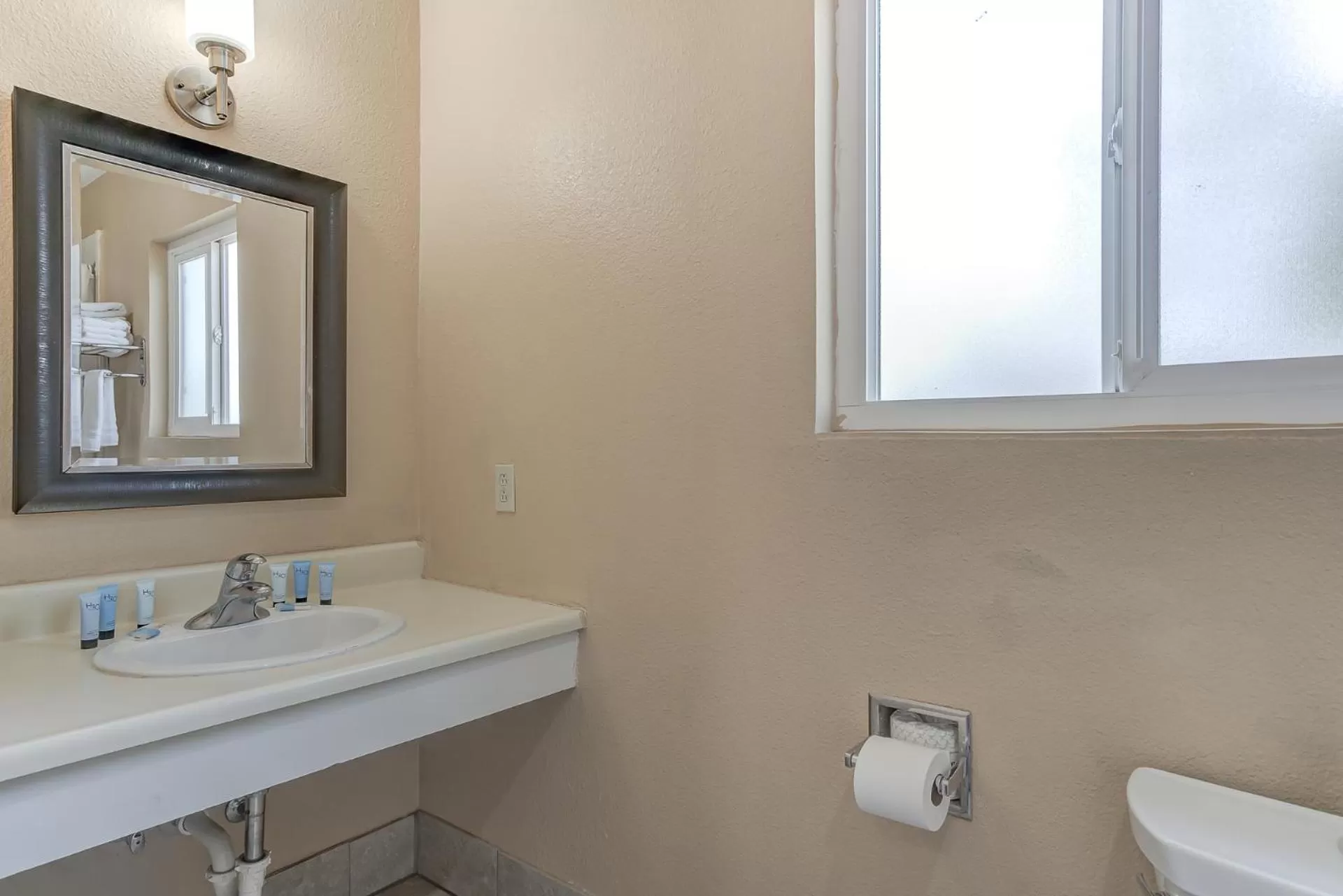 Toilet in Shasta Pines Motel & Suites