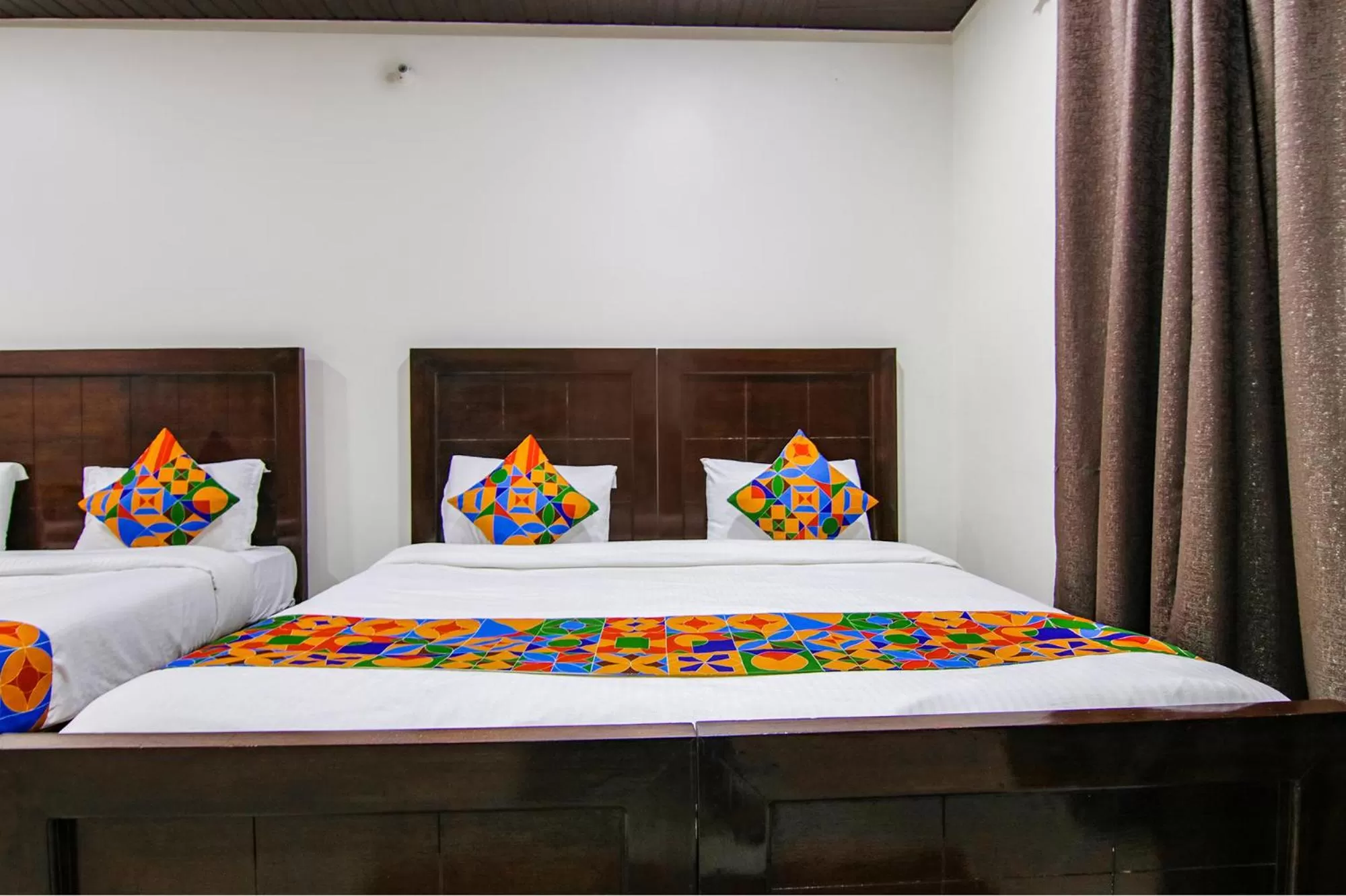 Bed in FabHotel Prime Olive Lake View