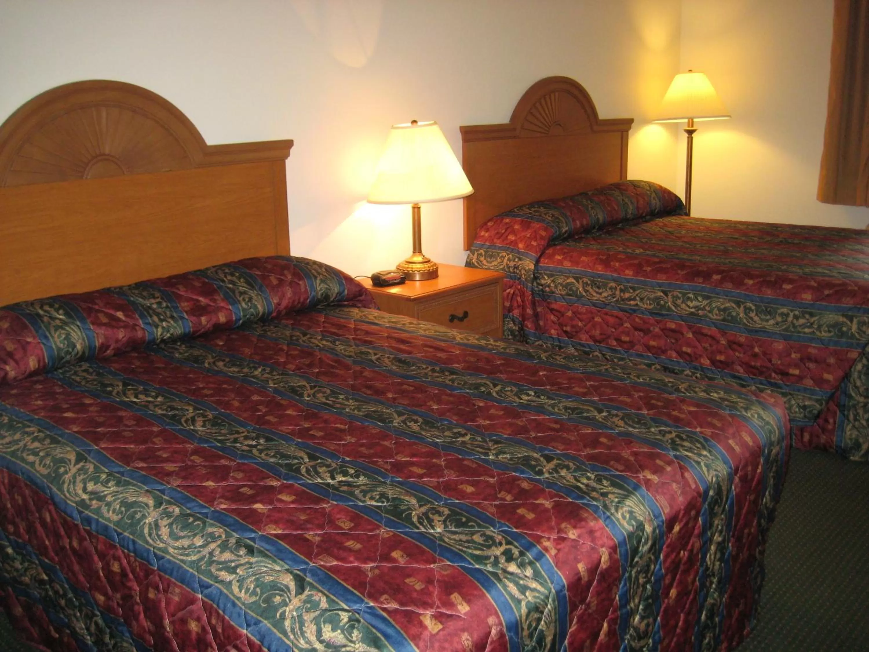 Bed in Horizon Inn & Suites