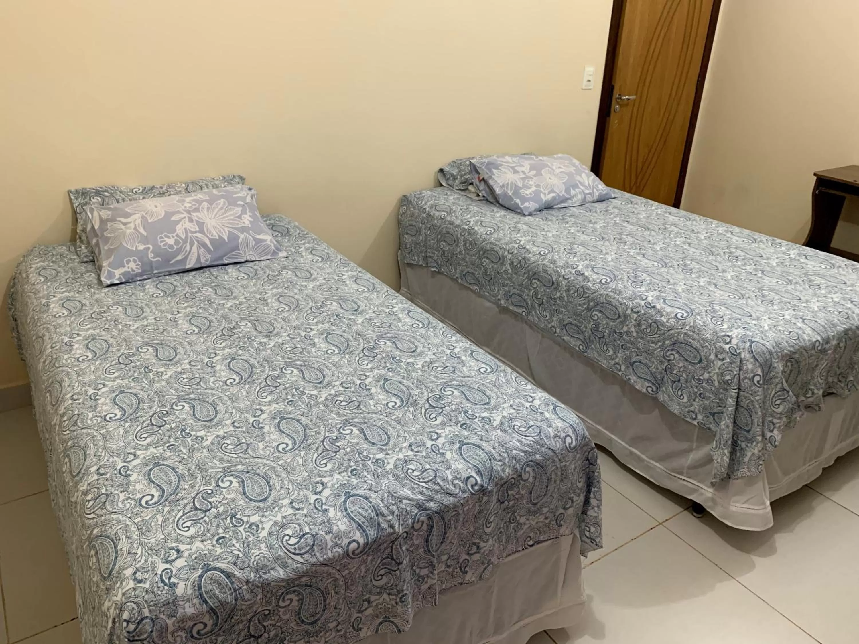 Bed in Pousada Jardim Brasília