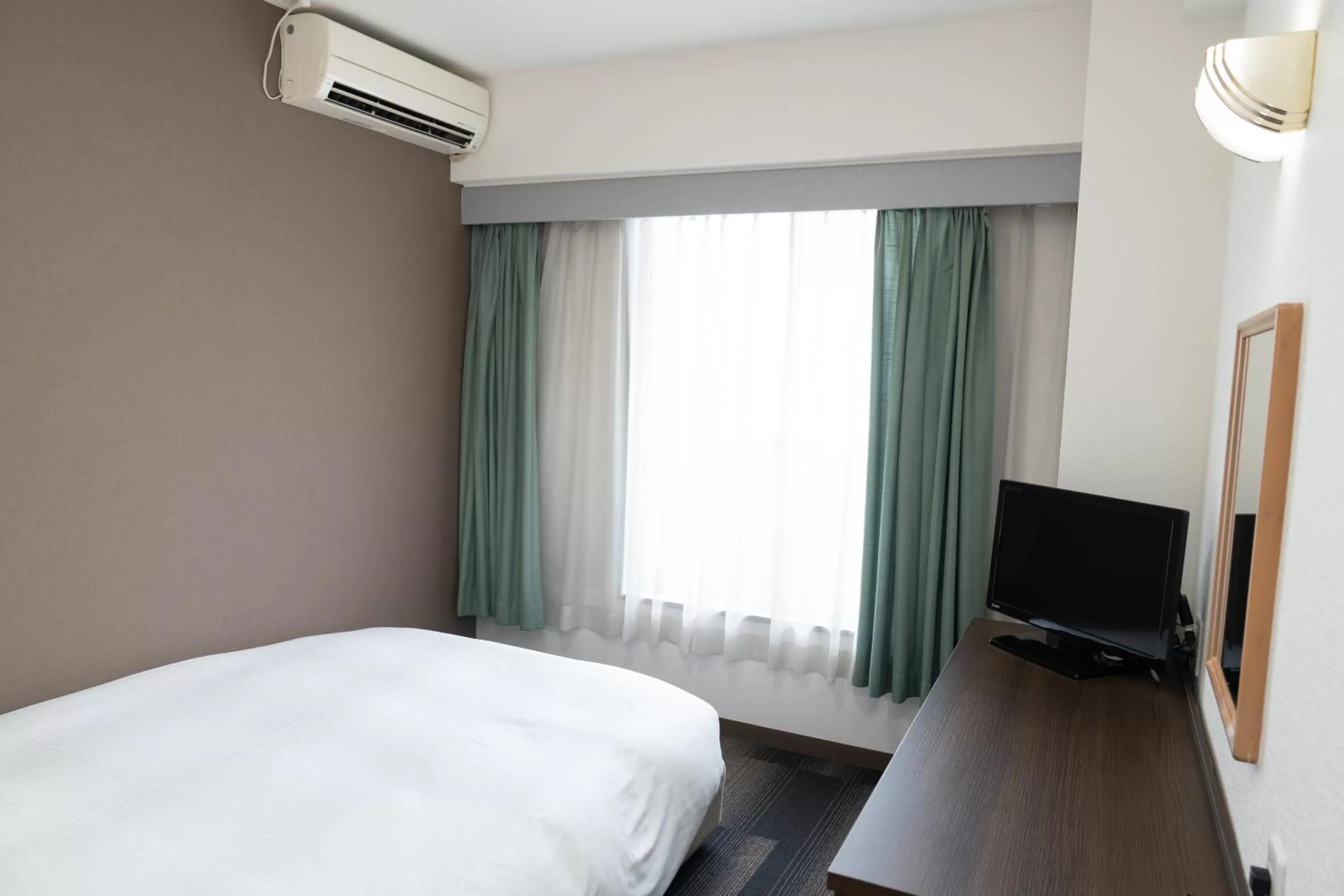 Photo of the whole room, Bed in Heiwadai Hotel Tenjin