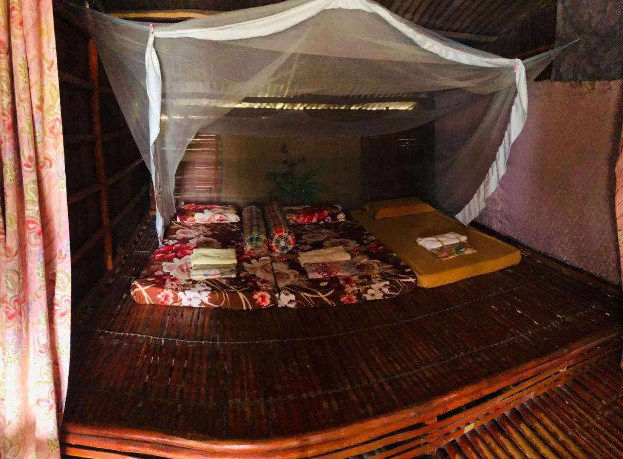 Bed in Dragon Pearl Beach Resort