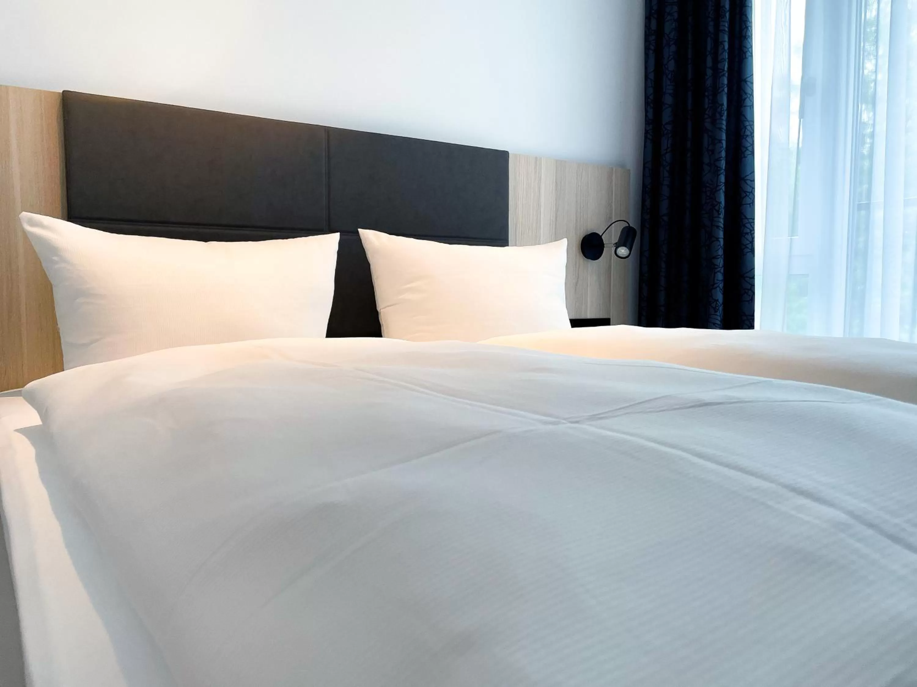 Bed in HOLI-Berlin Hotel