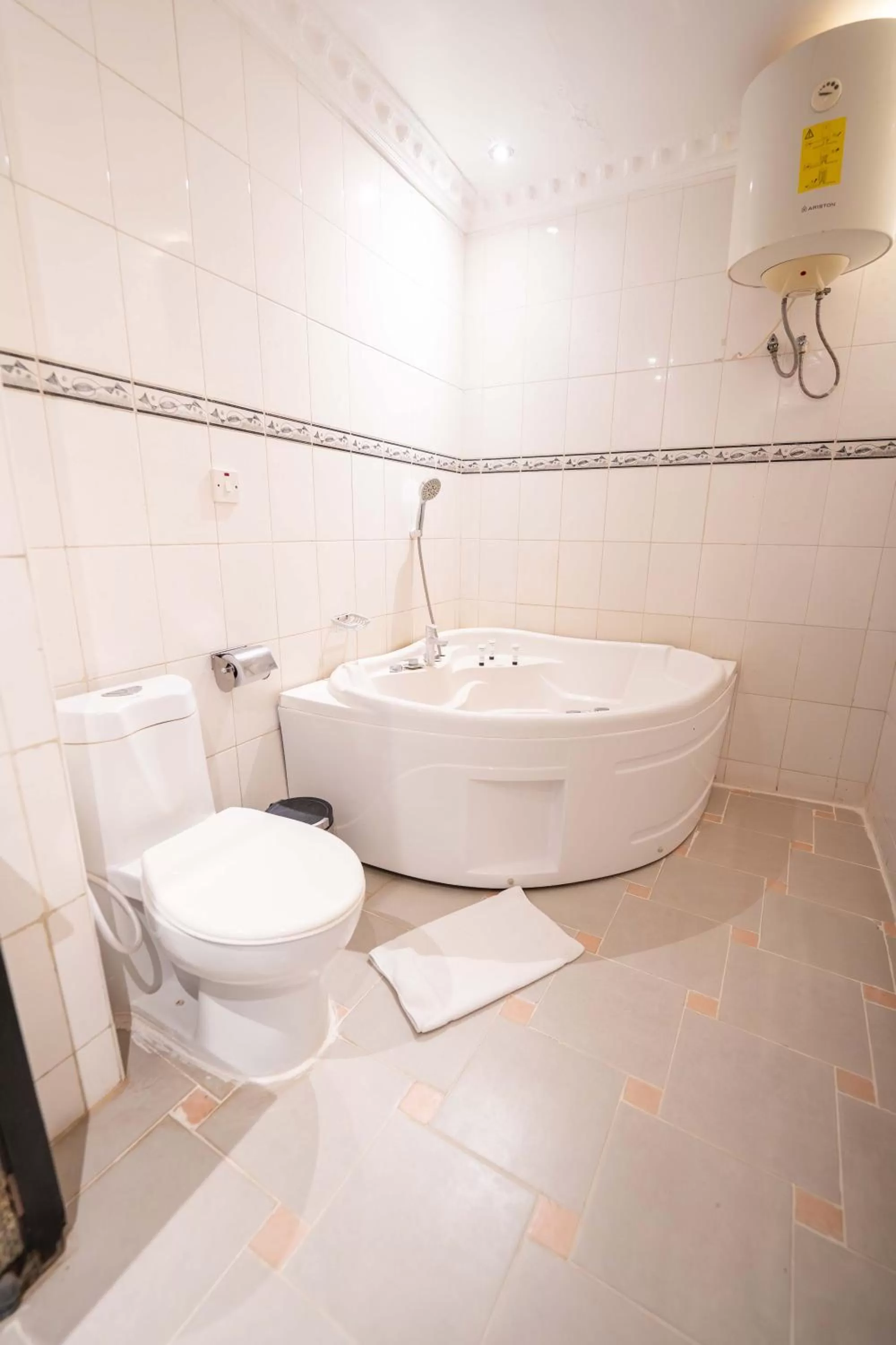 Toilet in Golden Tulip Stone Town Boutique