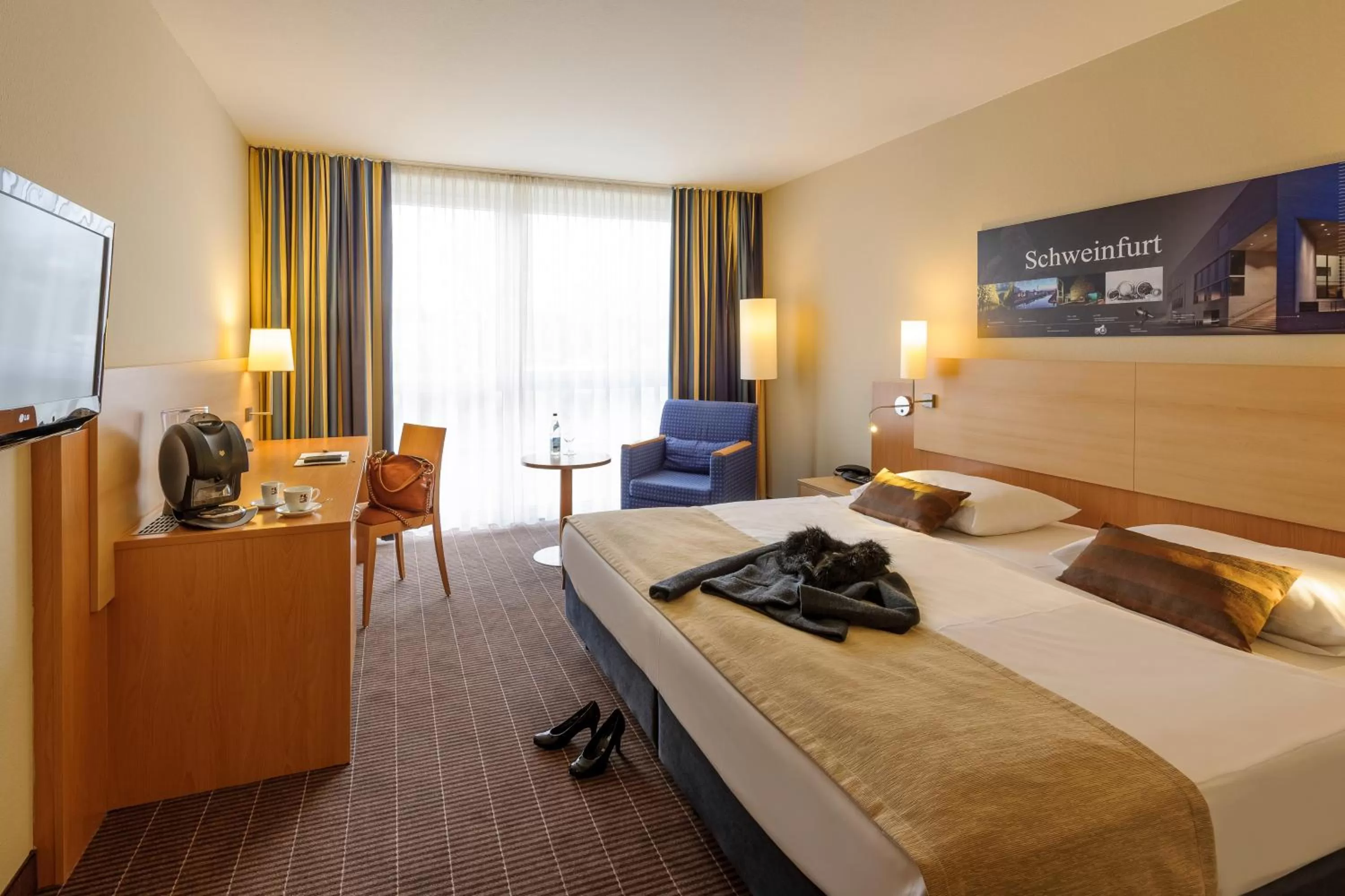 Photo of the whole room, Bed in Mercure Hotel Schweinfurt Maininsel