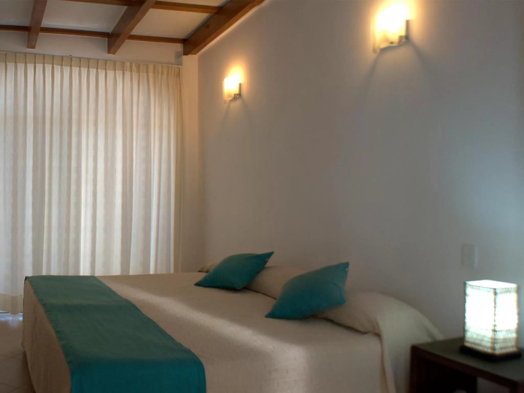 Bed in Hotel Galapagos Suites B&B