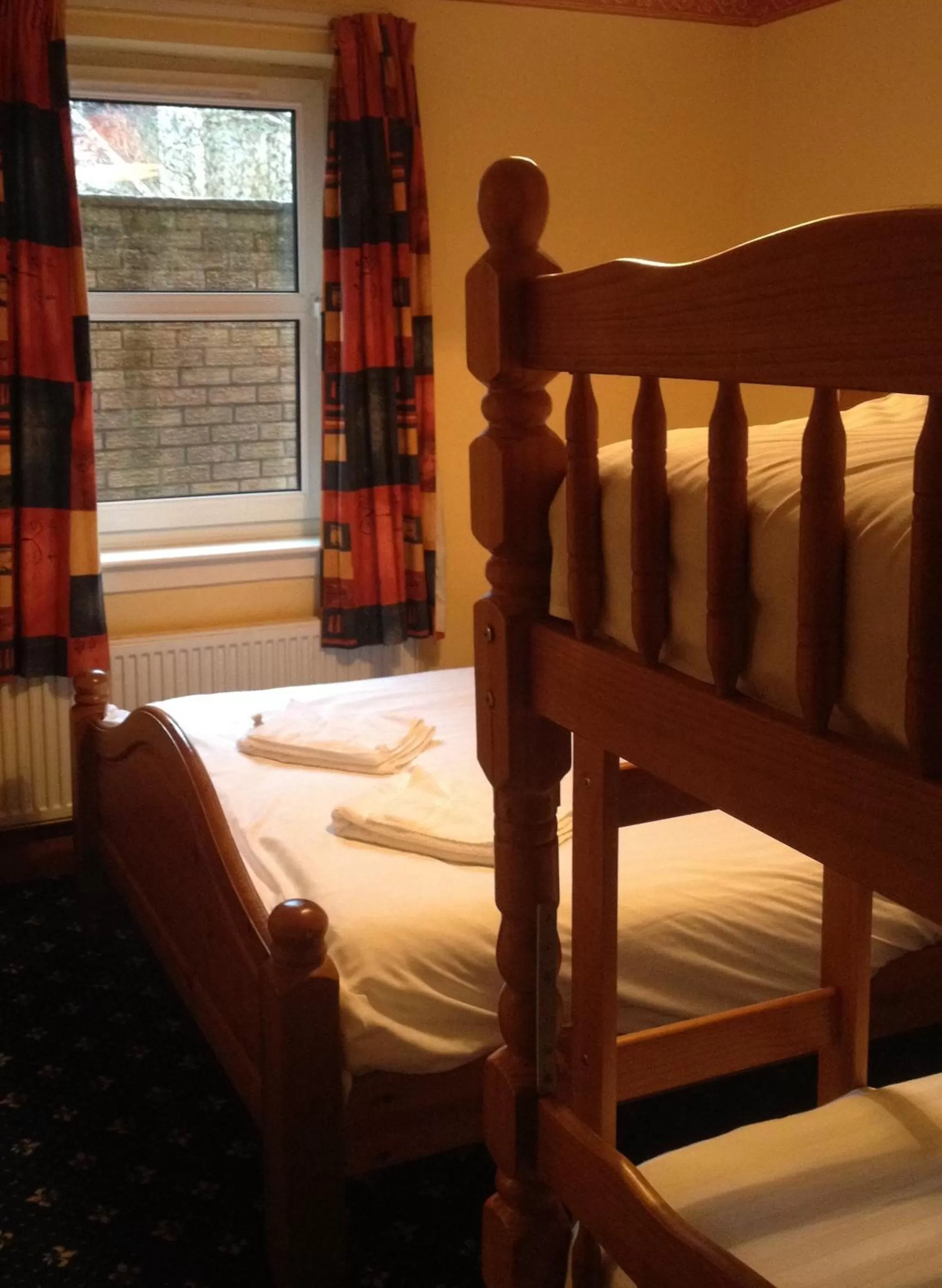 Bed in Twin Lions Hotel