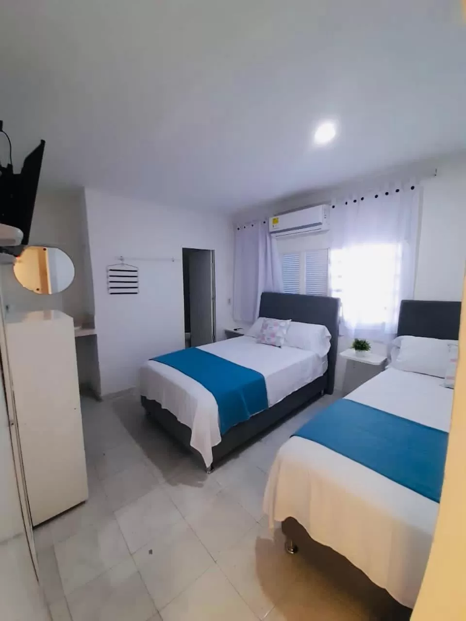 Bed in Tita’s Airport Hotel