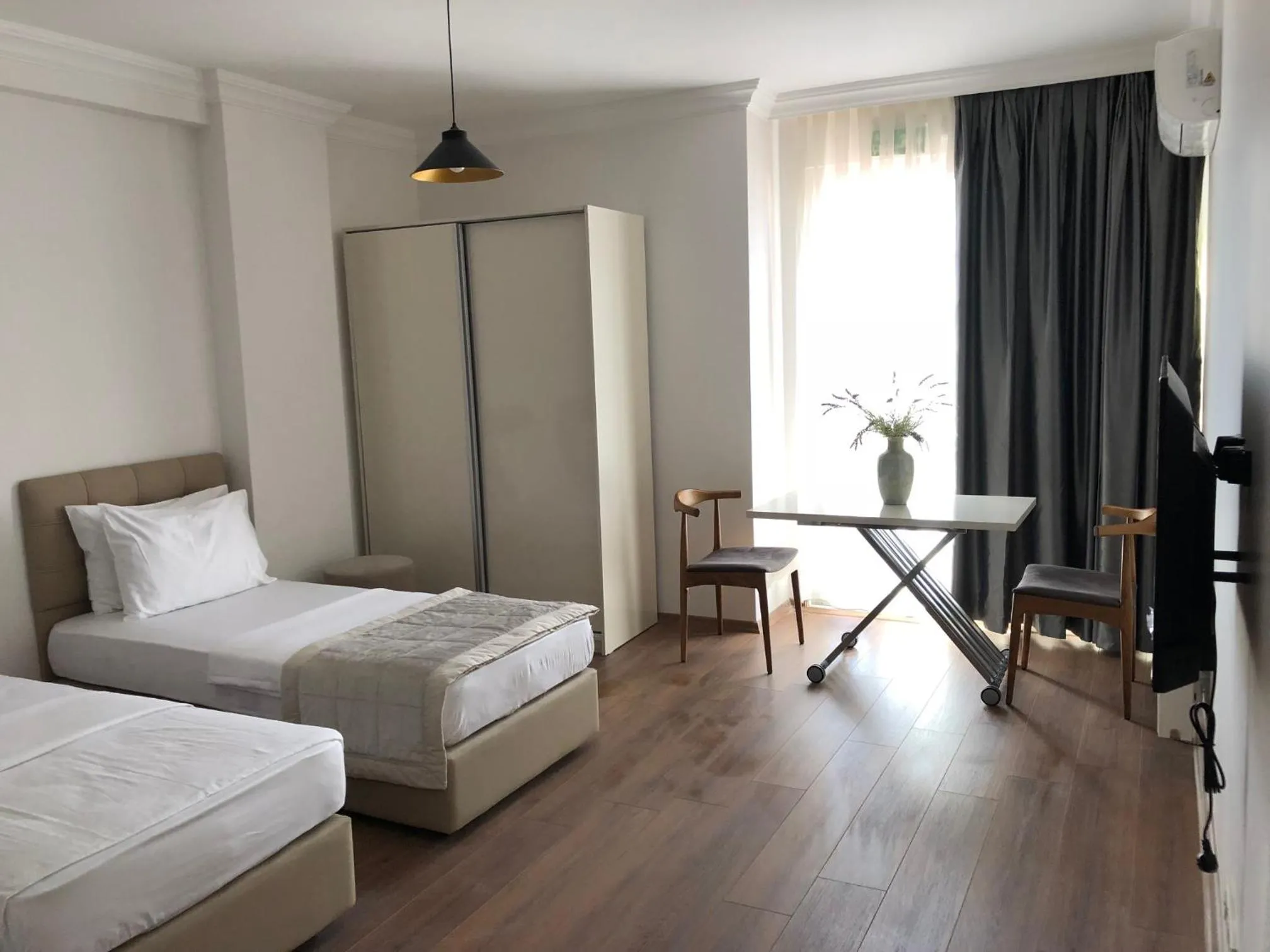 Seating area, Bed in Joy Suites