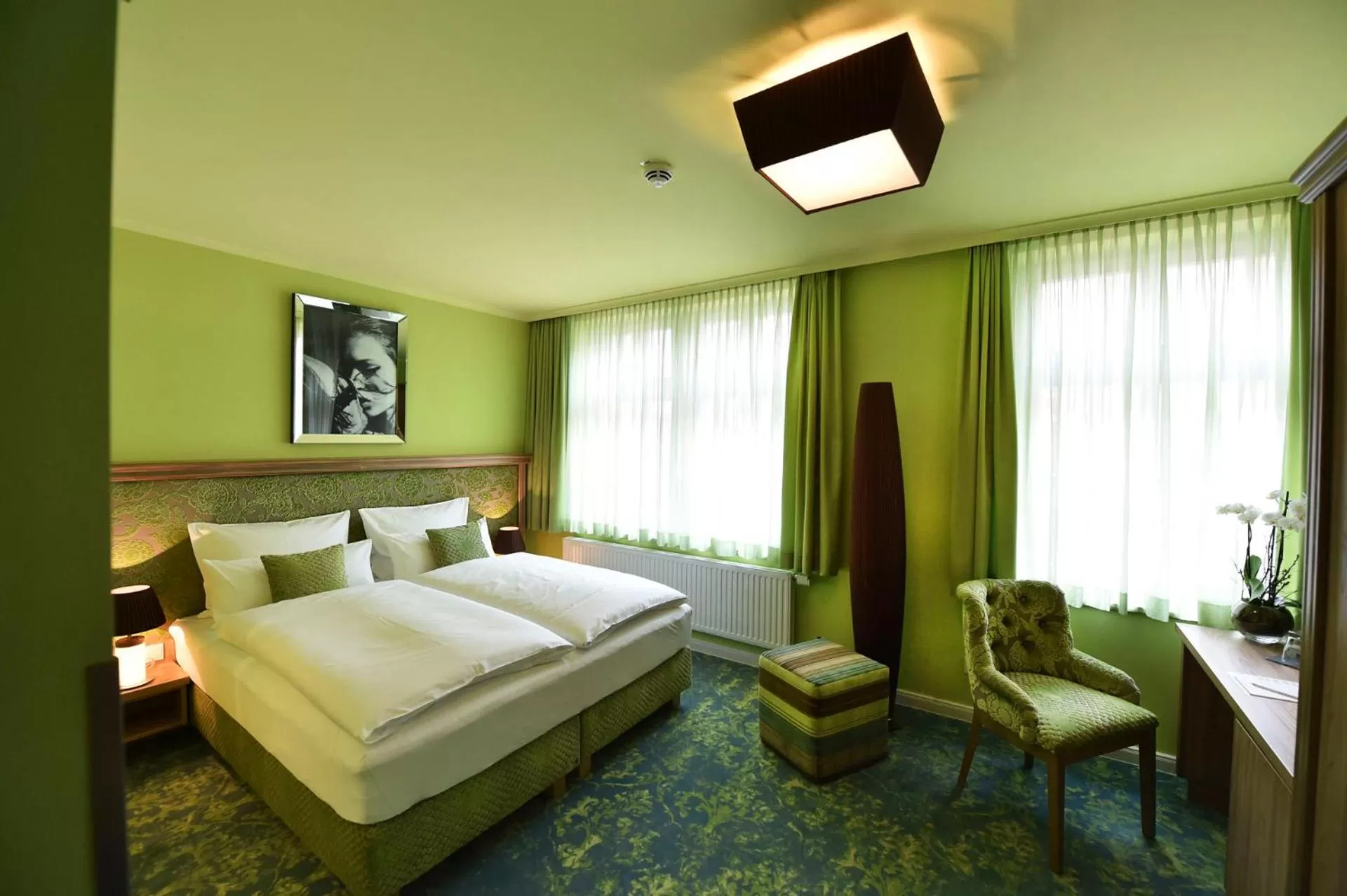 Photo of the whole room, Bed in MOMENTS Boutique Hotel