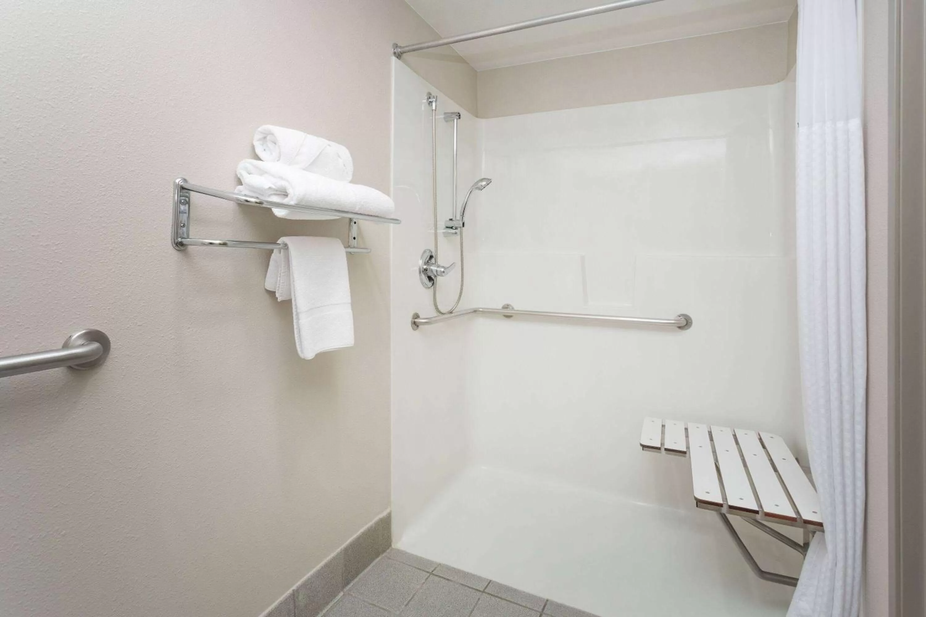 Shower in Days Inn & Suites by Wyndham Denver International Airport