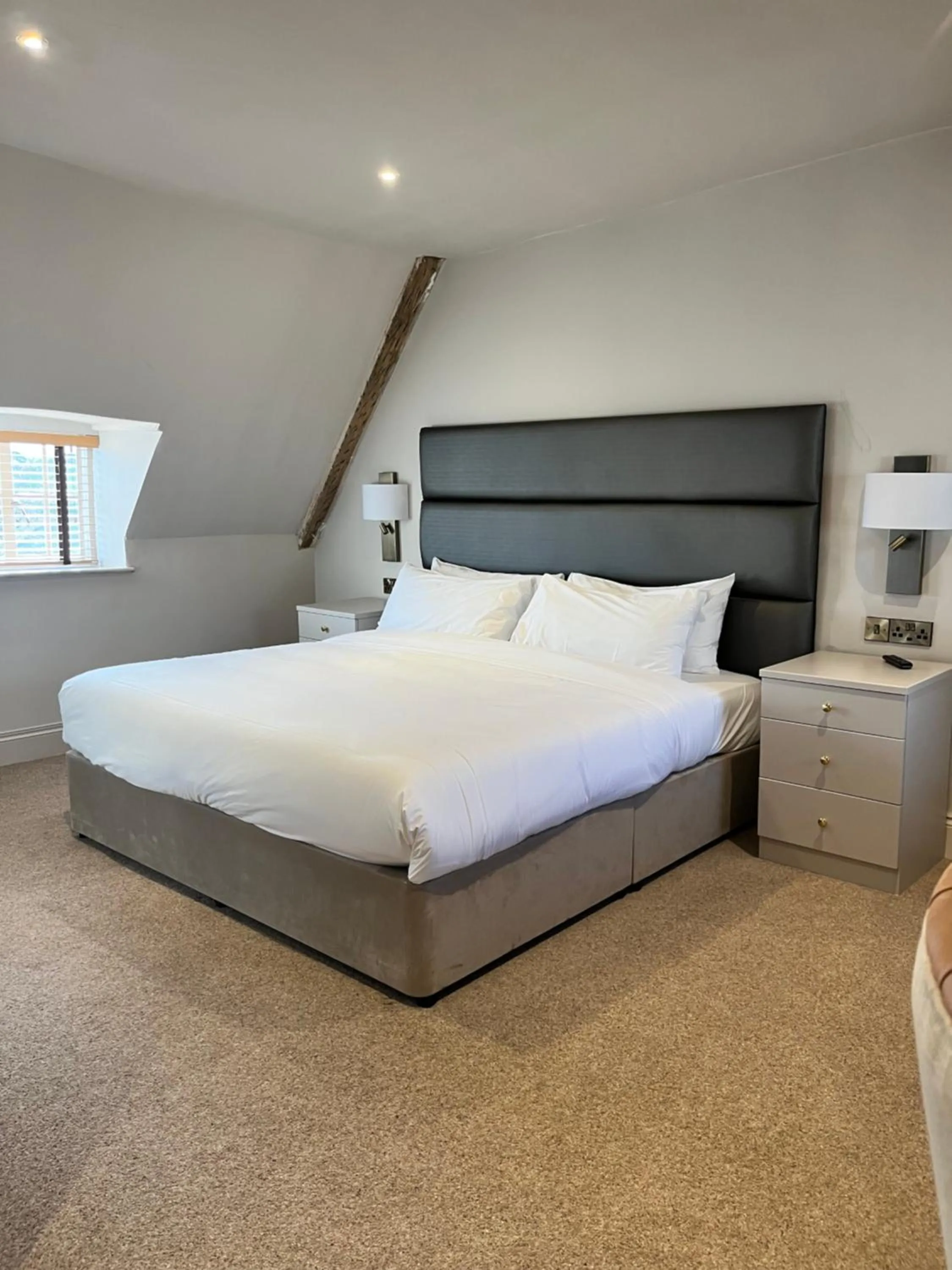 Bed in The Haycock Manor Hotel