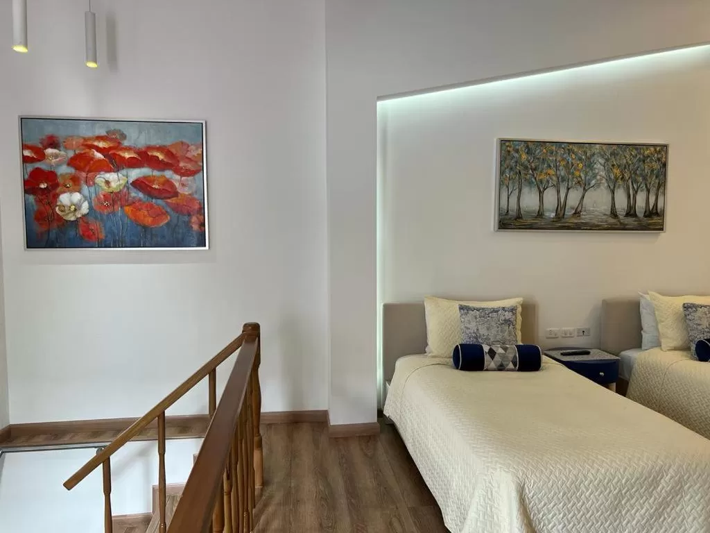 Bed in Adamas House Hotel Boutique