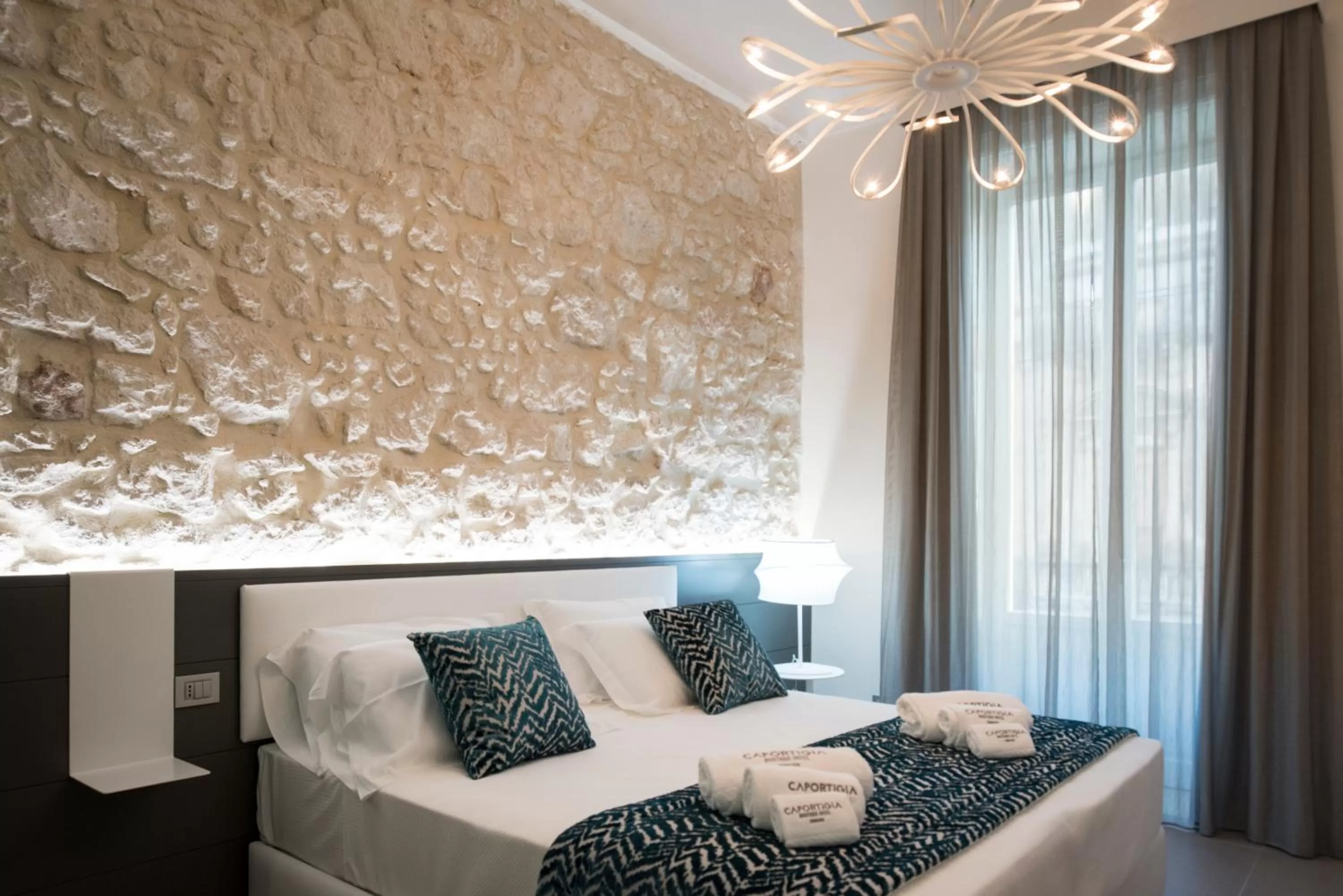 Bed in Caportigia Boutique Hotel