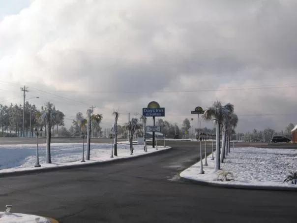 Property logo or sign in Days Inn & Suites by Wyndham Swainsboro