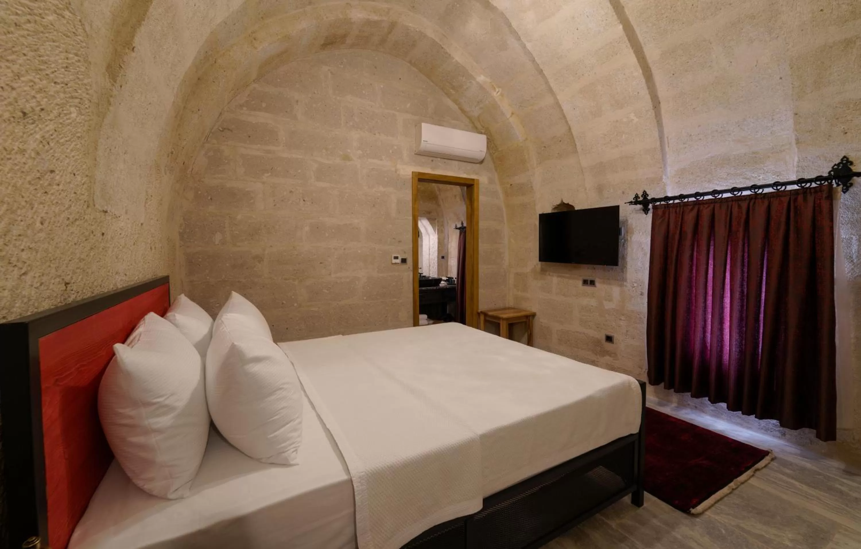 Bed in The Niche Cave Hotel