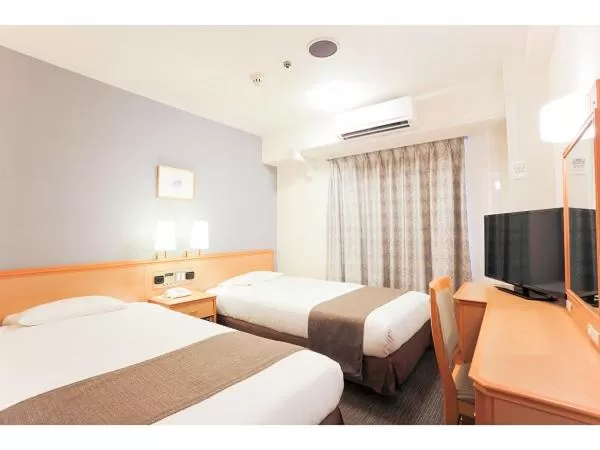 Bed in Smile Hotel Wakayama