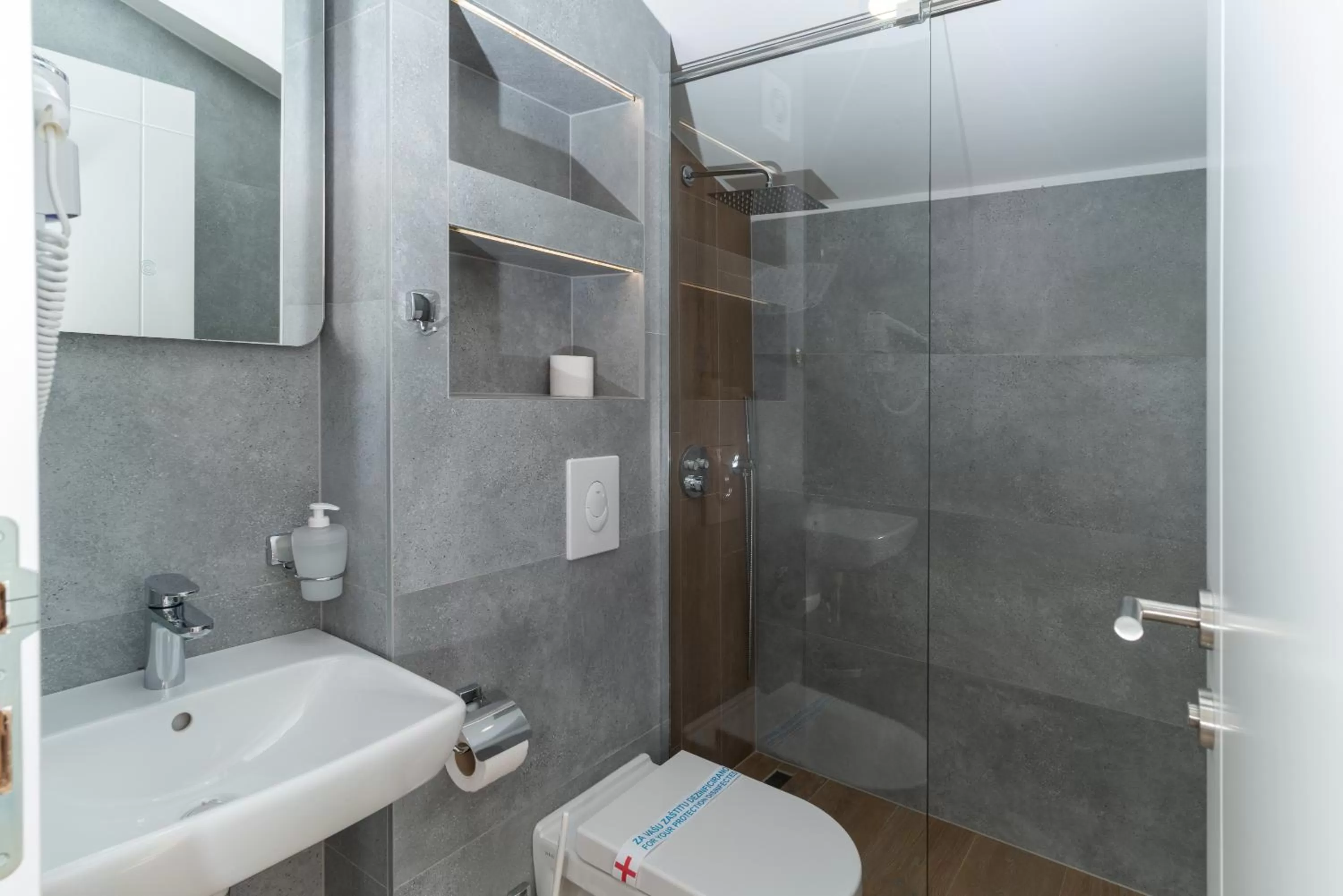 Bathroom in Ornament Hotel and Apartments