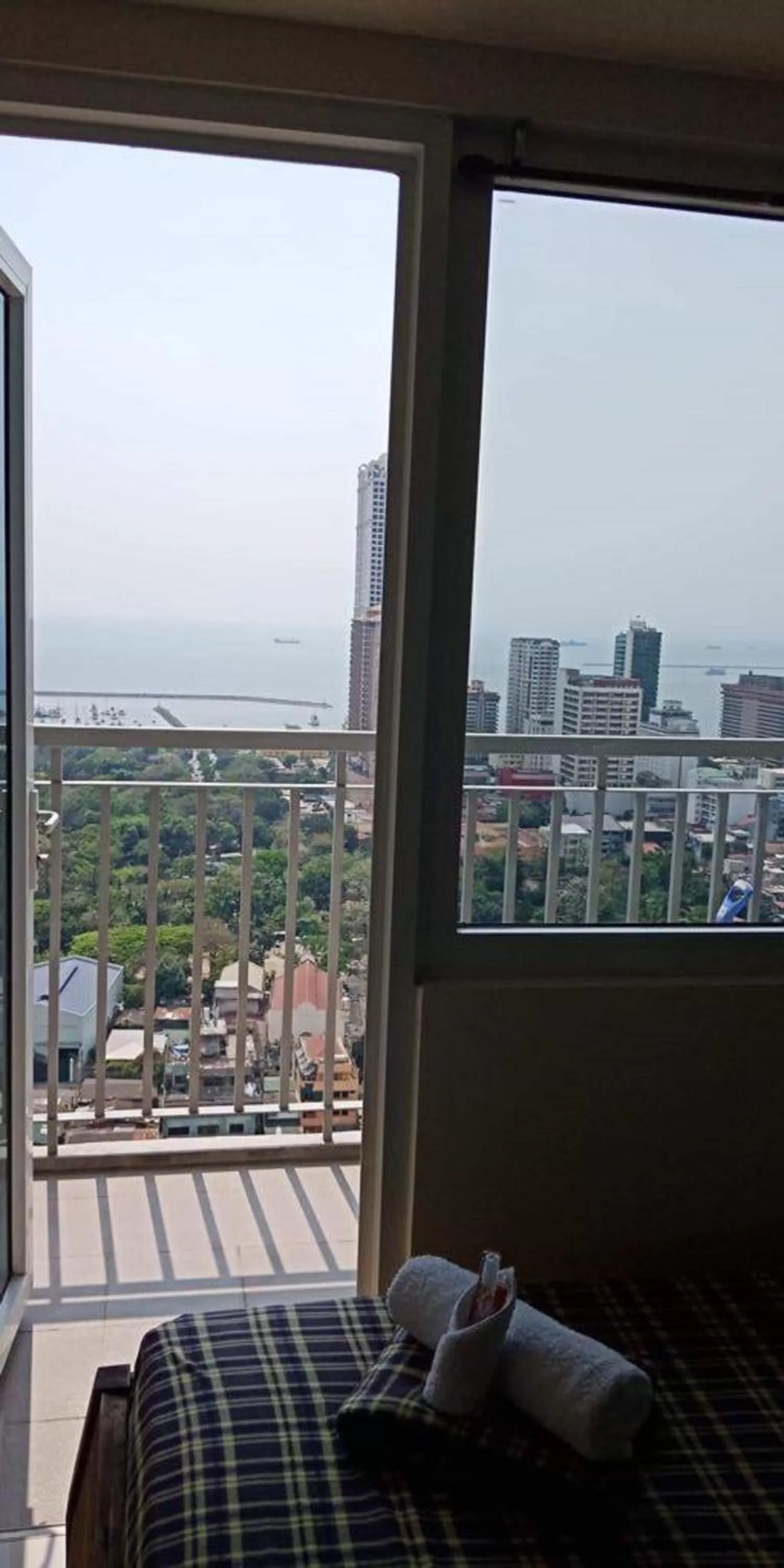 Balcony/Terrace, Bed in Green Residences Stays by PBYY