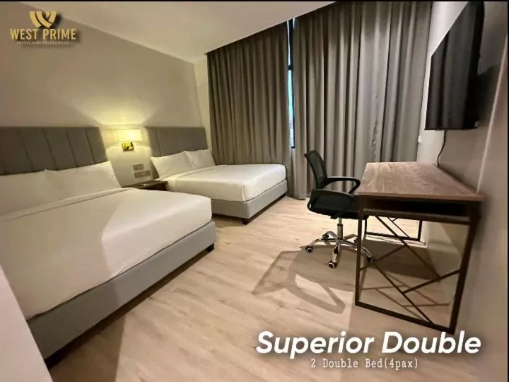 Bed in West Prime Hotel