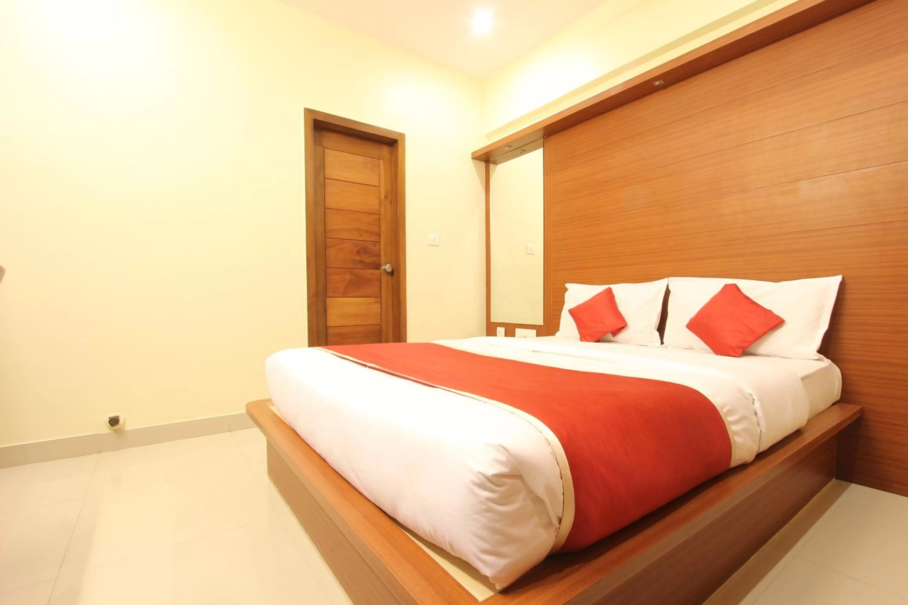 Bed in The Grand Inn Mysore