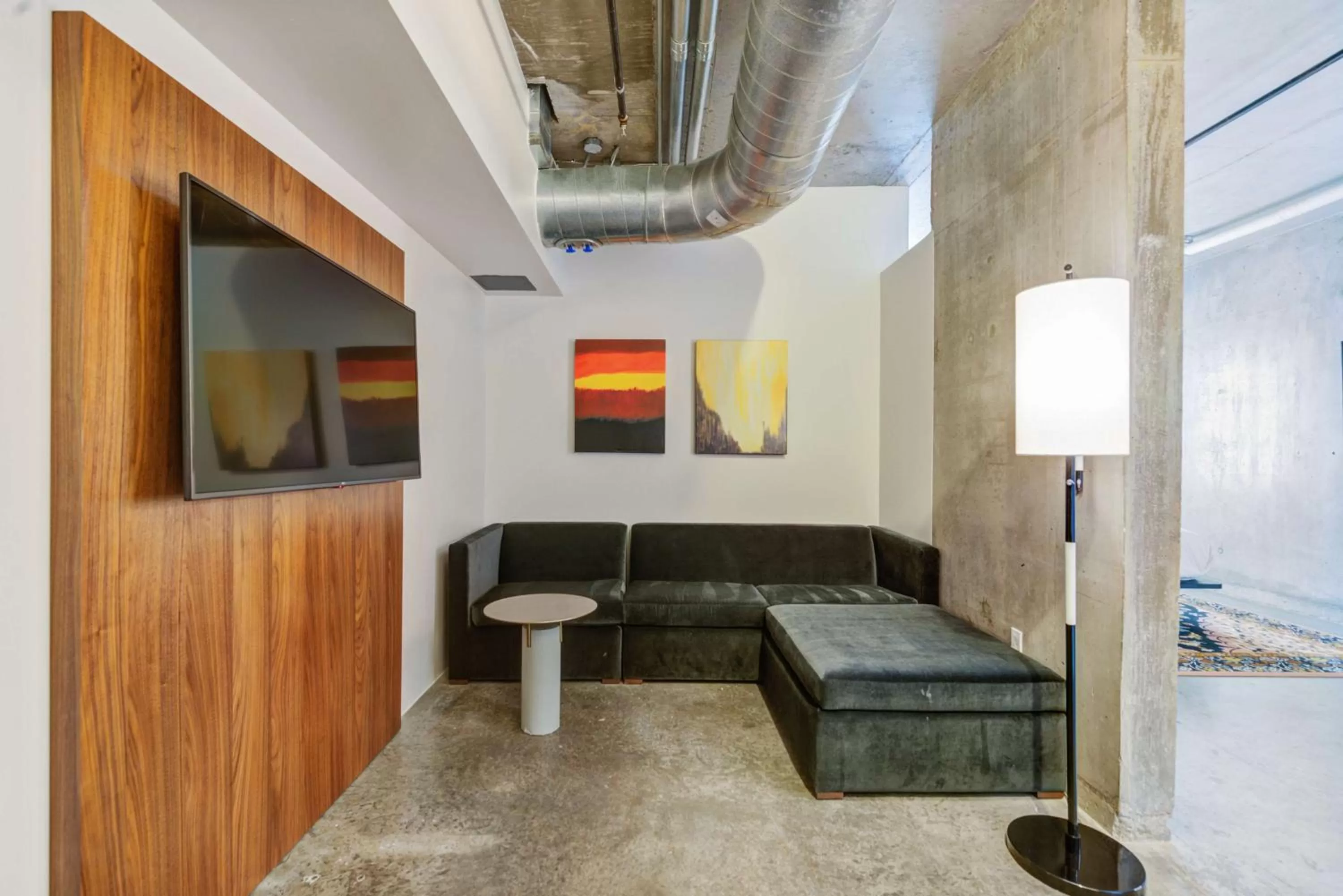 Living room in NYLO Dallas Plano Hotel, Tapestry Collection by Hilton