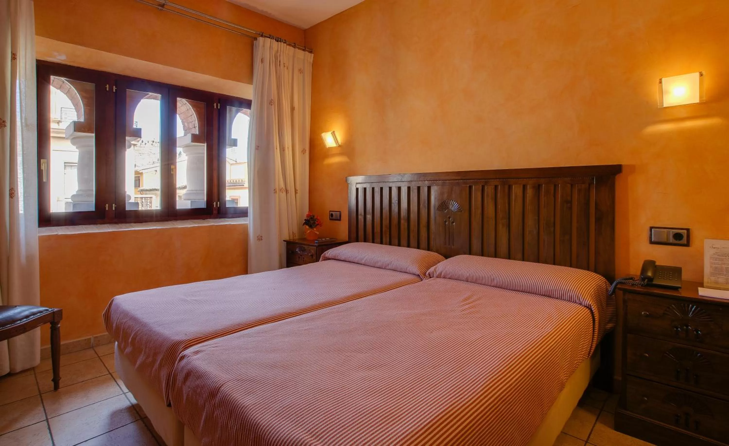 Bed in L'Agora Hotel