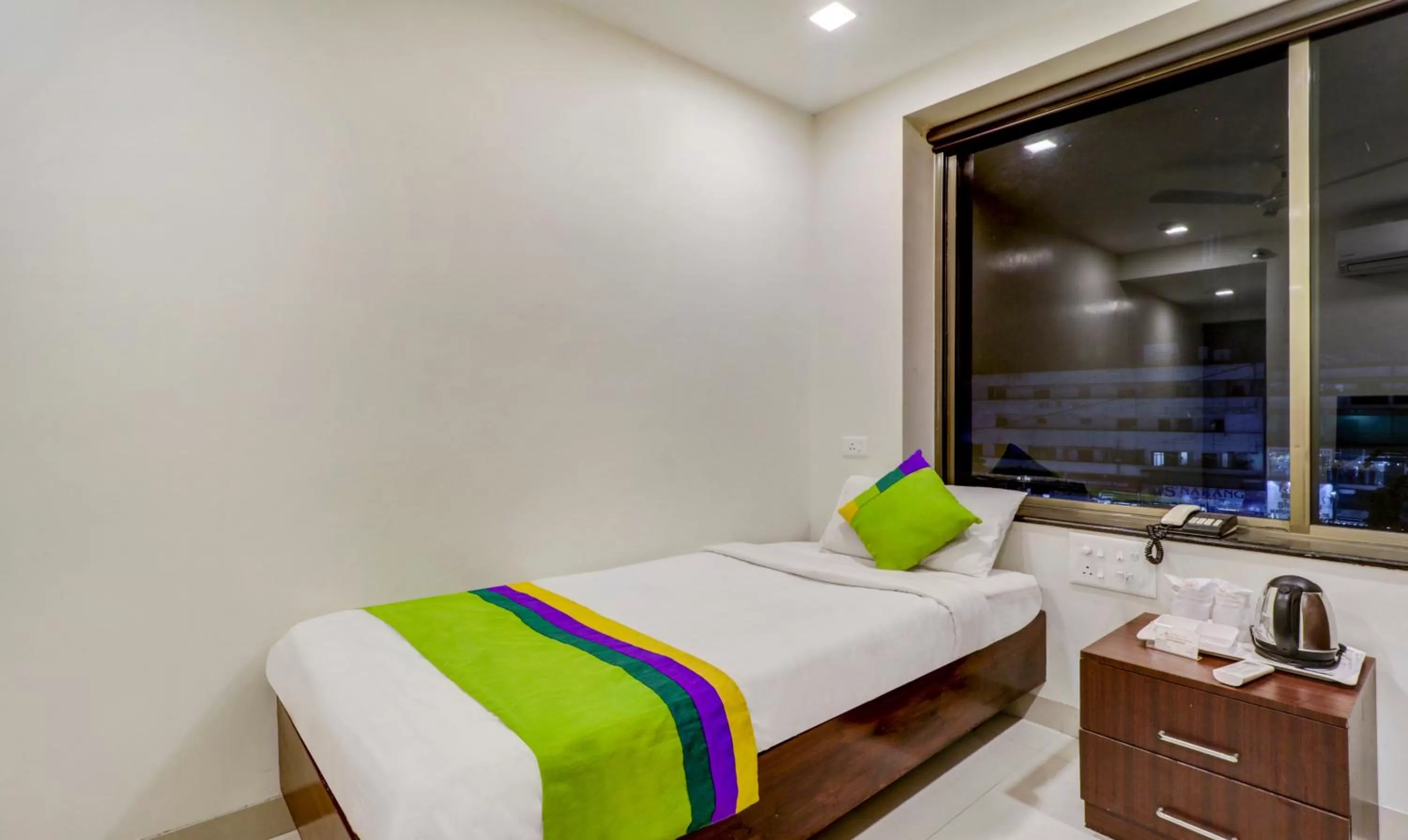 Bed in Treebo Trend Orange City